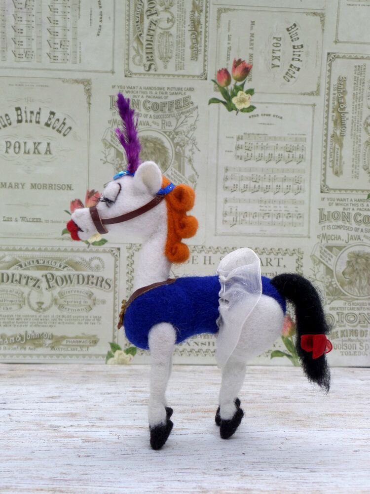 Angela circus horse plush in profile Angela circus horse plush made to order by hand, orange curls, blue saddle cloth, black tail with a red bow