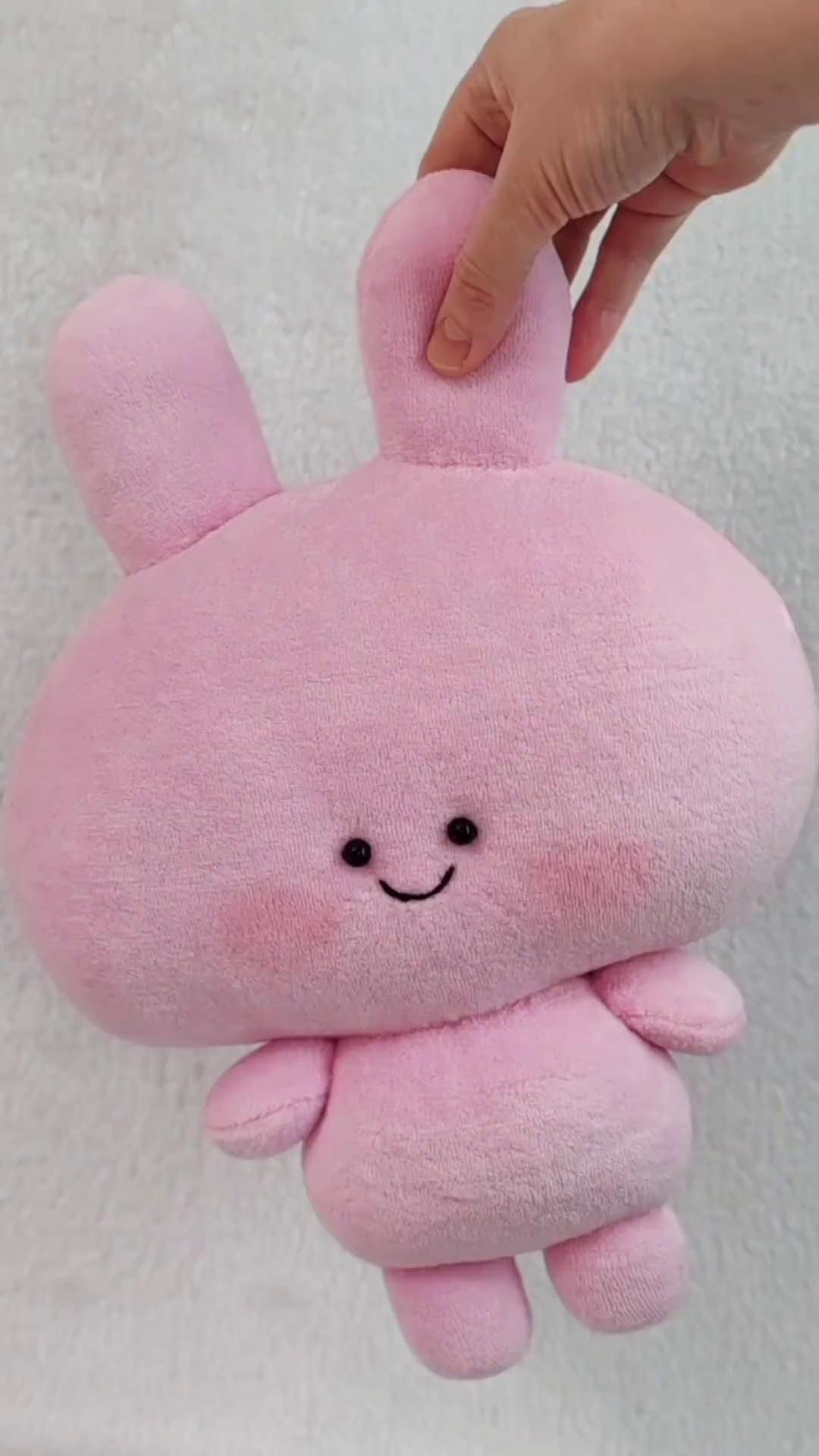Asamimi-chan plush hanging from one ear Pink Asamimi-chan plush hanging from one ear and still smiling, handmade kawaii bunny made to order