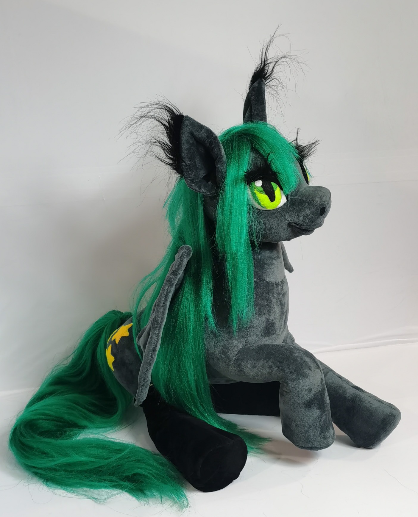 Bat pony plush sitting Bat pony plush sitting with front legs stretched out, long green tail and star cutie mark, made to order