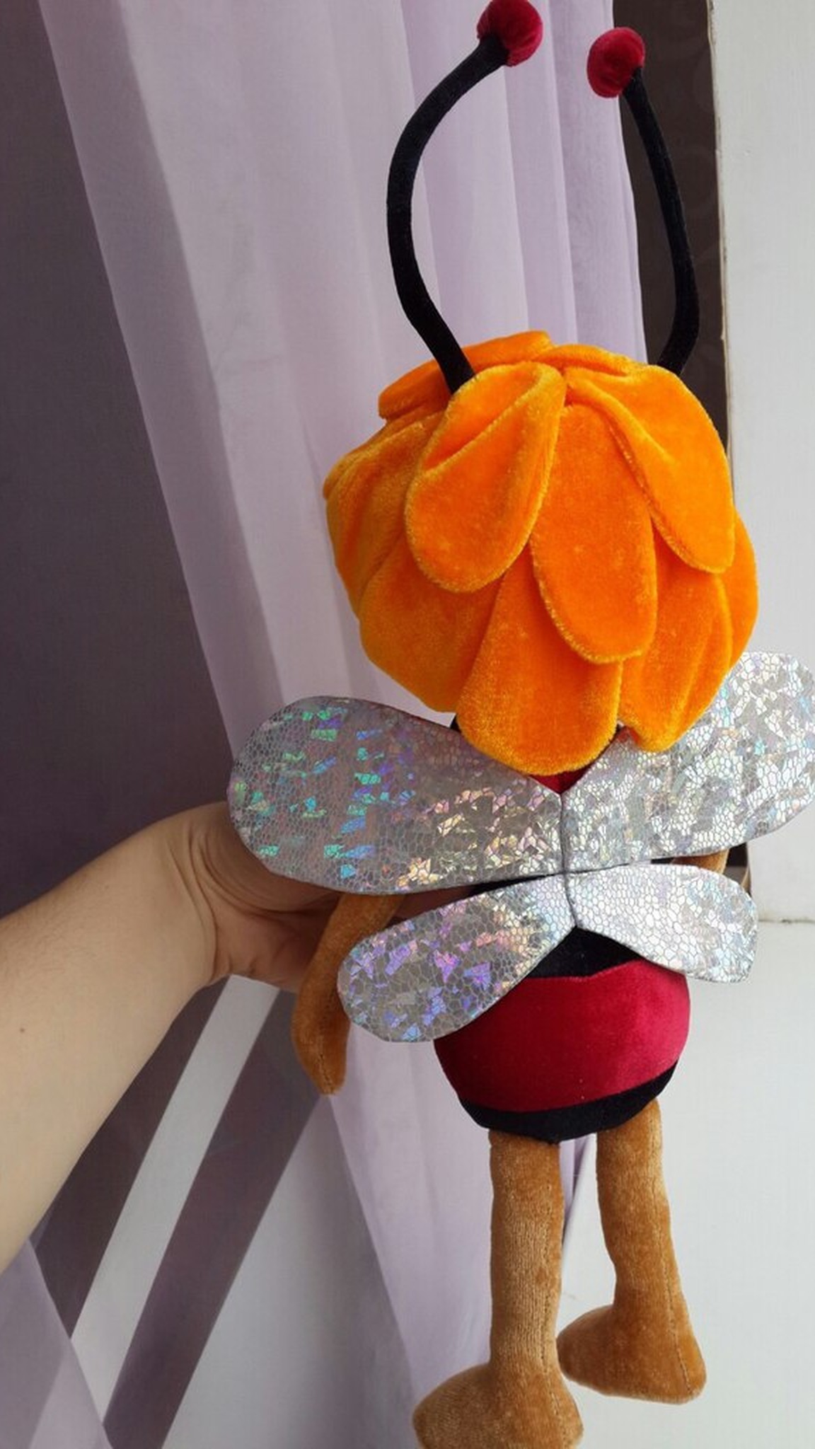 Bee plush with two pairs of holographic silver wings and orange petal hair like a flower, handmade to order
