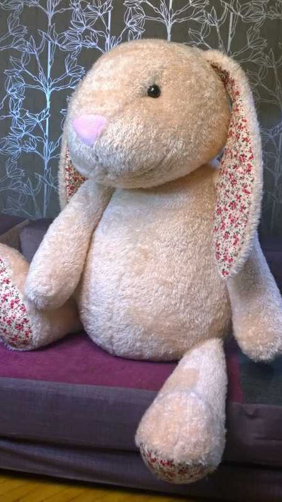 Big bunny plush made to order, 1.2 m: floral-print foot soles, long arms, peach faux fur, sitting on a sofa