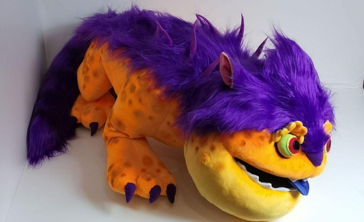Big Orange monster plush, 50 cm long Big Orange monster plush about 50 cm long, purple spikes down the back and purple claws on each paw, handmade