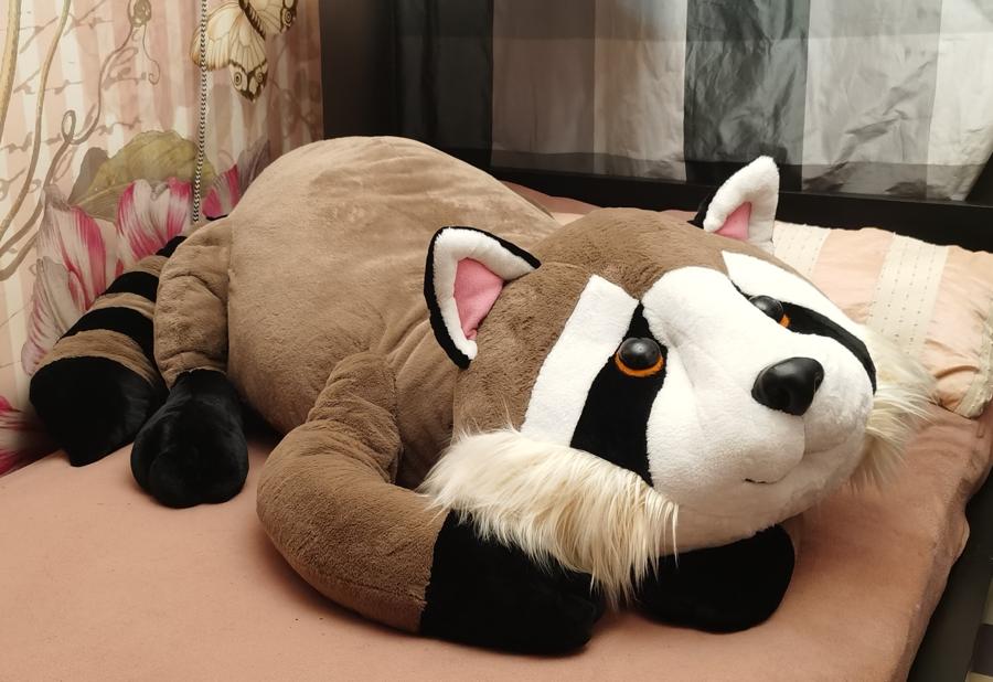 Big raccoon plush hug pillow Big raccoon plush hug pillow with a black-ringed tail and cream faux fur ruff, sewn by hand to order