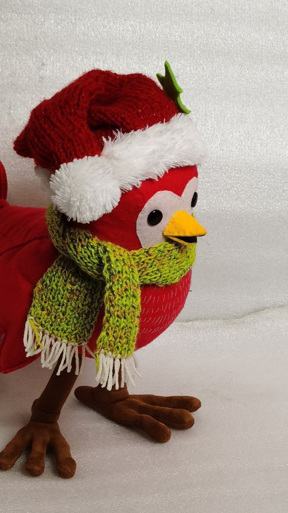 Christmas bird plush with white eye patches, a knit Santa hat and a green scarf, handmade to order