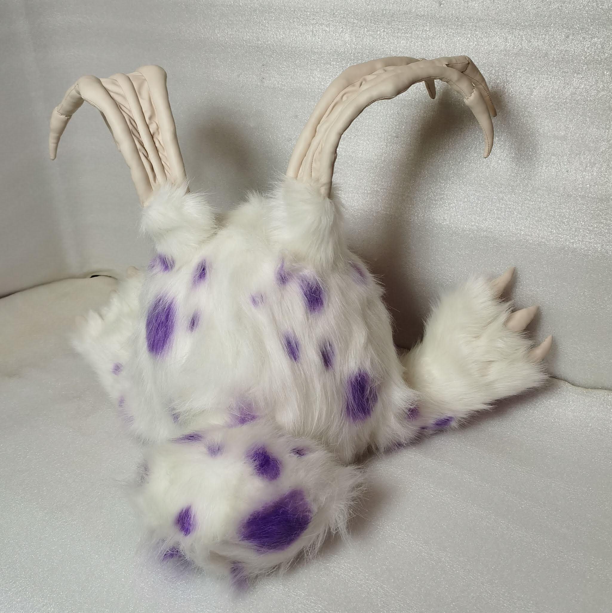 Blabbit plush faux fur Blabbit plush with purple spots on its white faux fur back, a round tail and bony finger ears, made to order