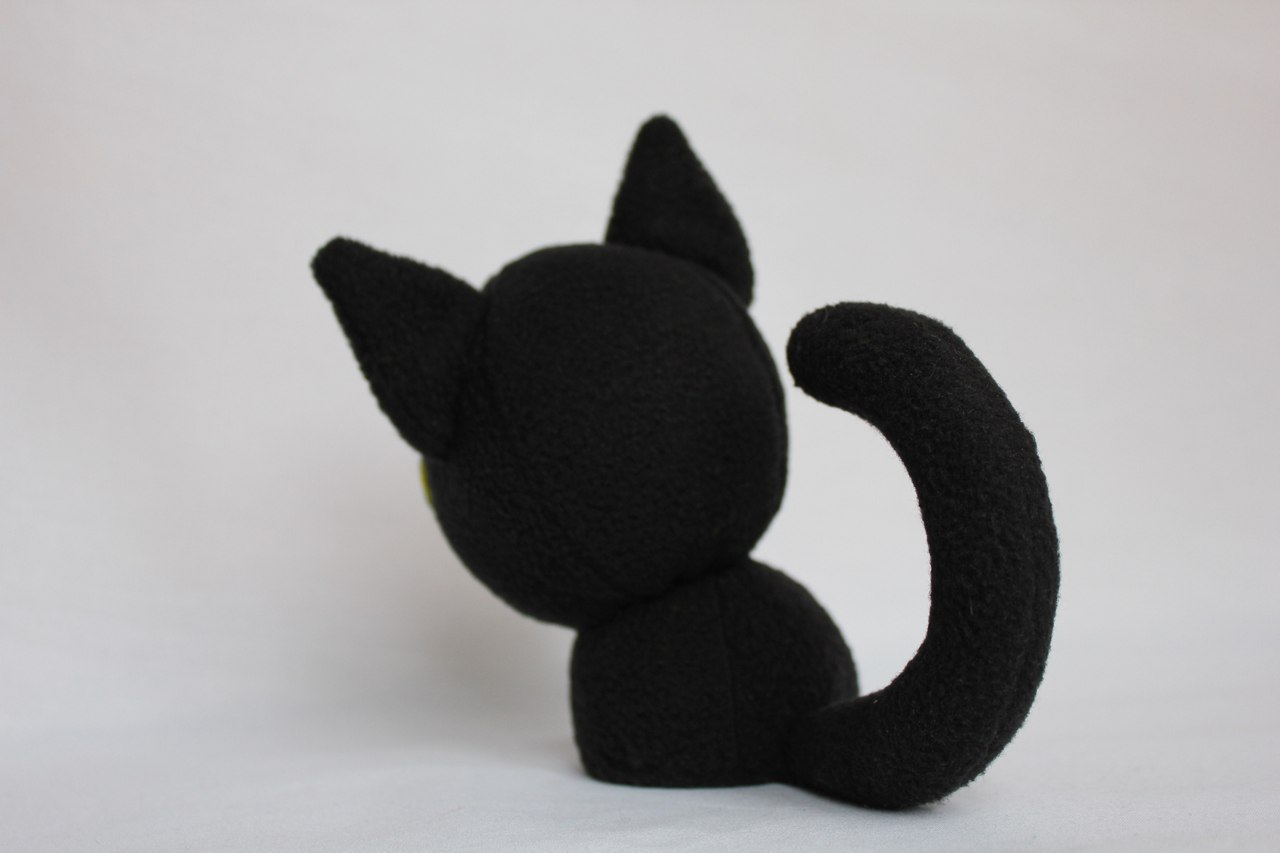 Black cat plush with a wired tail Black cat plush handmade to order from a drawing, long tail with a wire frame inside so it keeps its curve