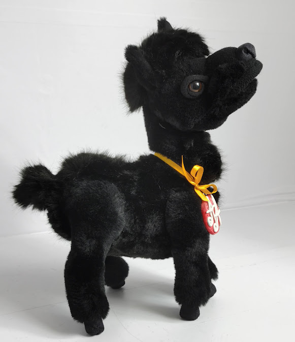 Black llama stuffed animal with a yellow ribbon Black llama stuffed animal standing with its muzzle raised, yellow ribbon on the neck, made to order