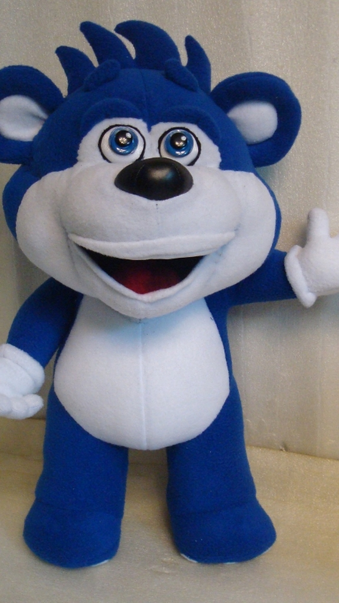 Blue bear plush with removable clothes taken off: white tummy, spiky blue tuft and wide grin, made to order