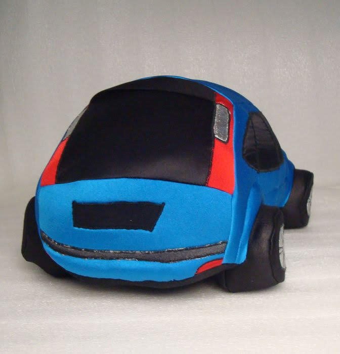 Blue car plush hatch and taillights Soft blue car plush hatch with red fabric panels, silver taillights and a black bumper, sewn to order