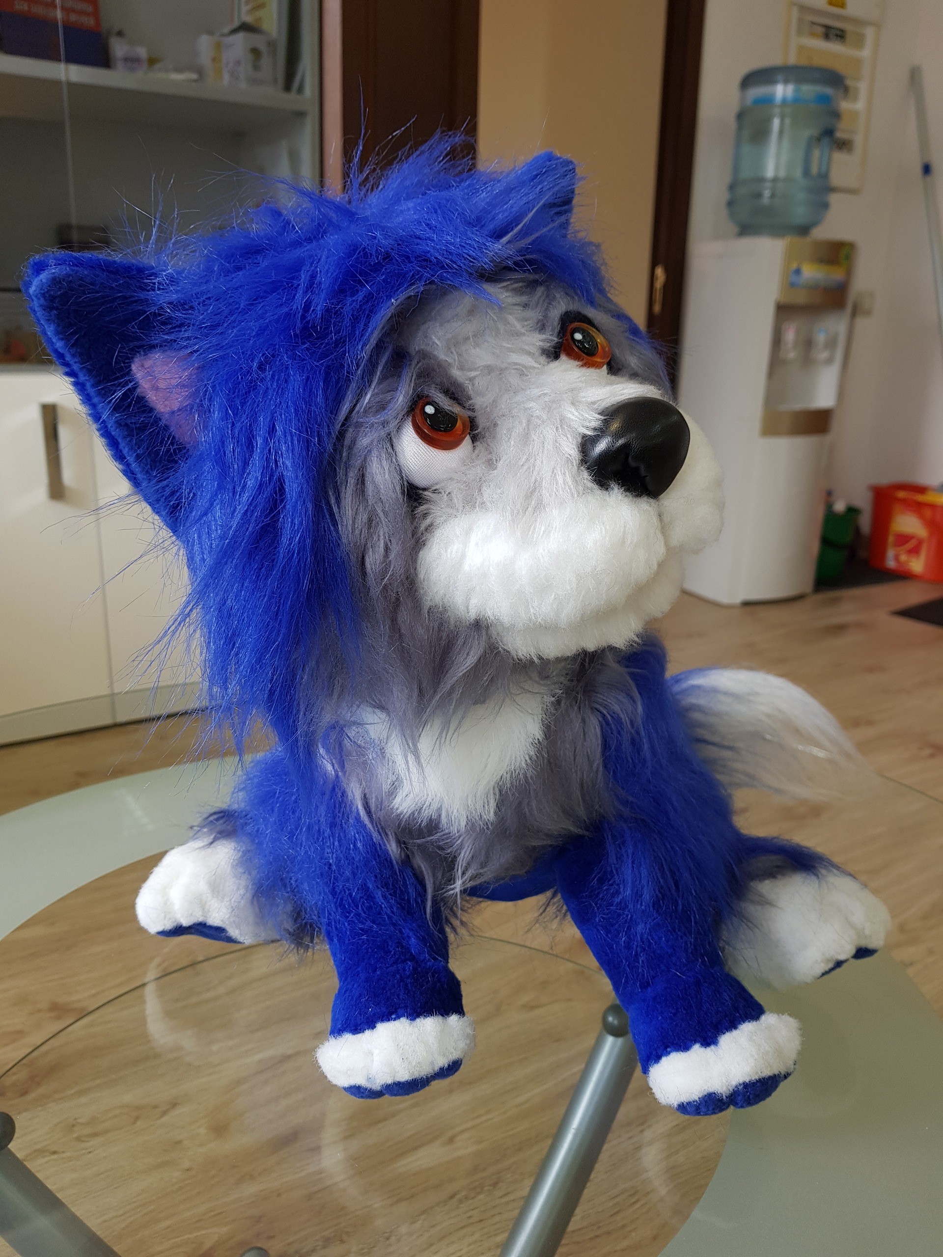 Blue dog plush with amber eyes Blue dog plush with big amber eyes, a black nose and a grey-white muzzle, sewn to order in long faux fur