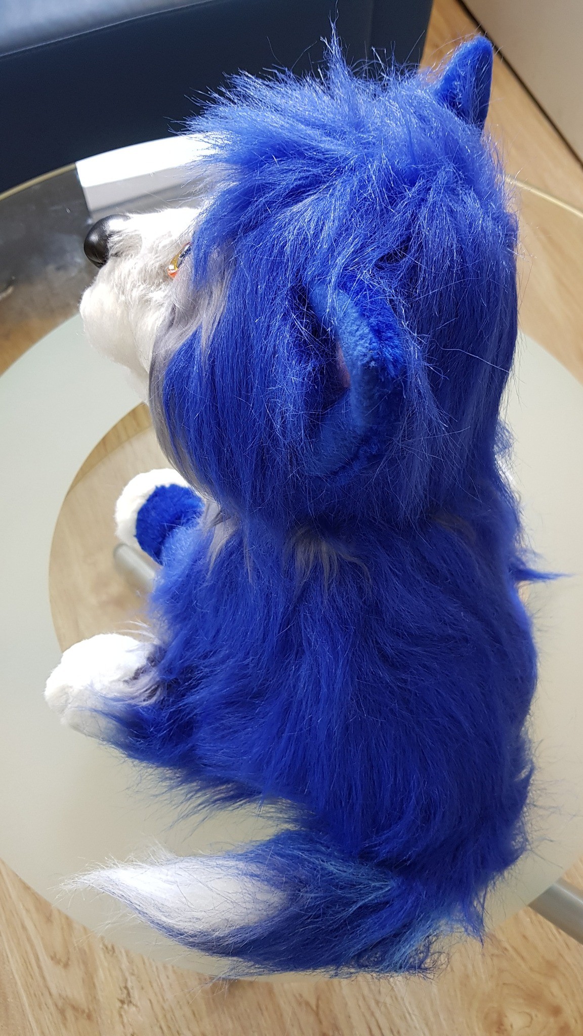 Blue dog plush with long shaggy faux fur on the back and a white-tipped tail, made to order