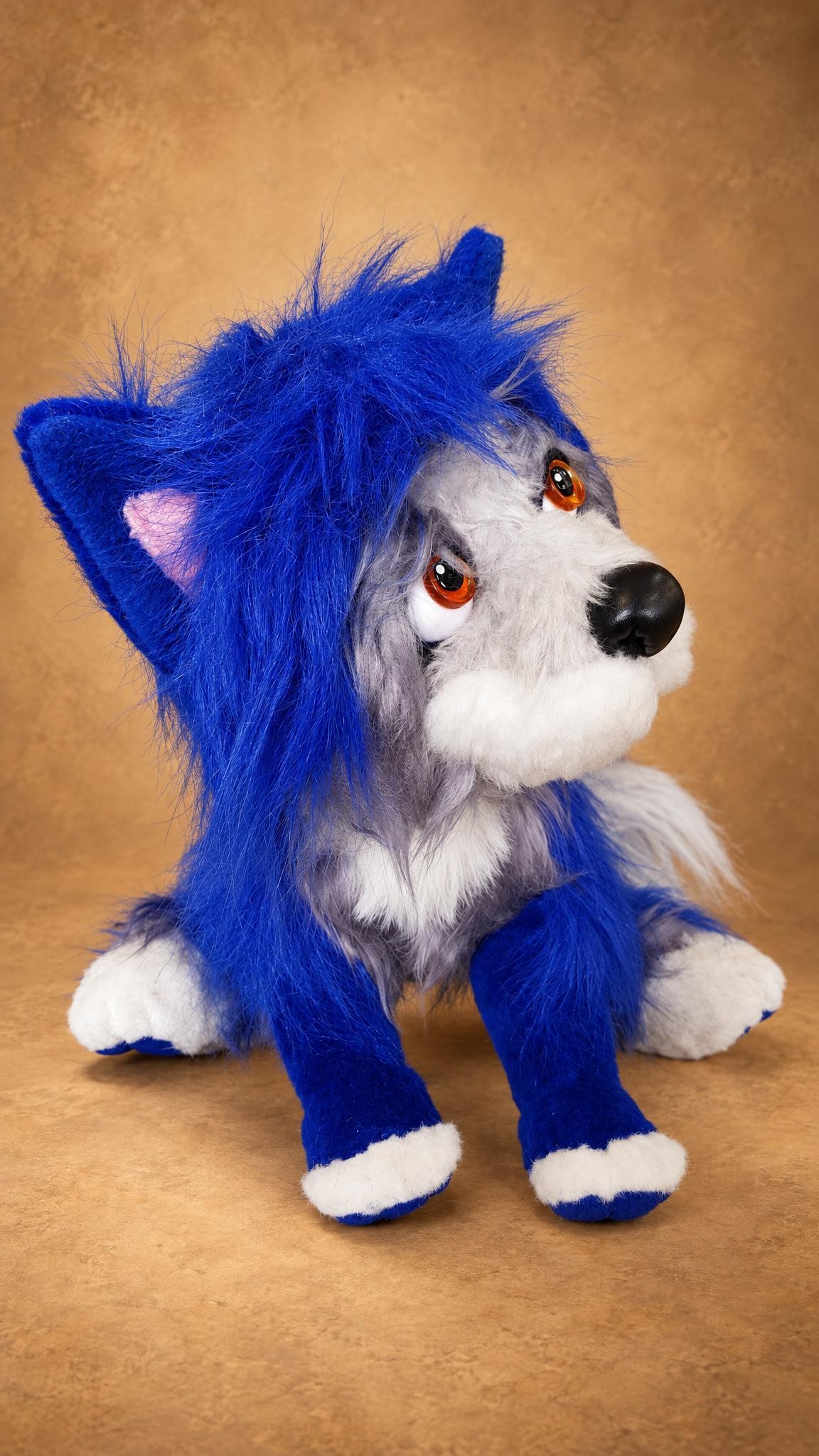 Shaggy blue dog plush with amber eyes and a grey-white face, handmade to order
