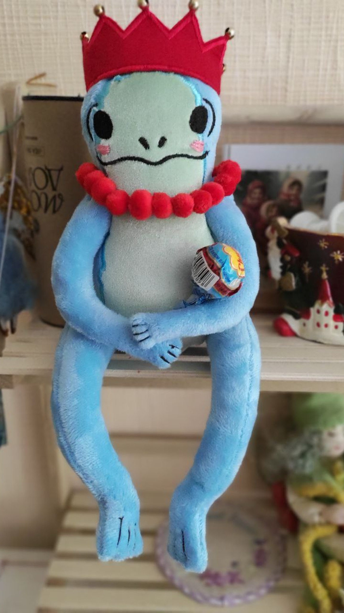 Blue frog plush in a crown holding a small toy in her long hand, sticker plush handmade to order