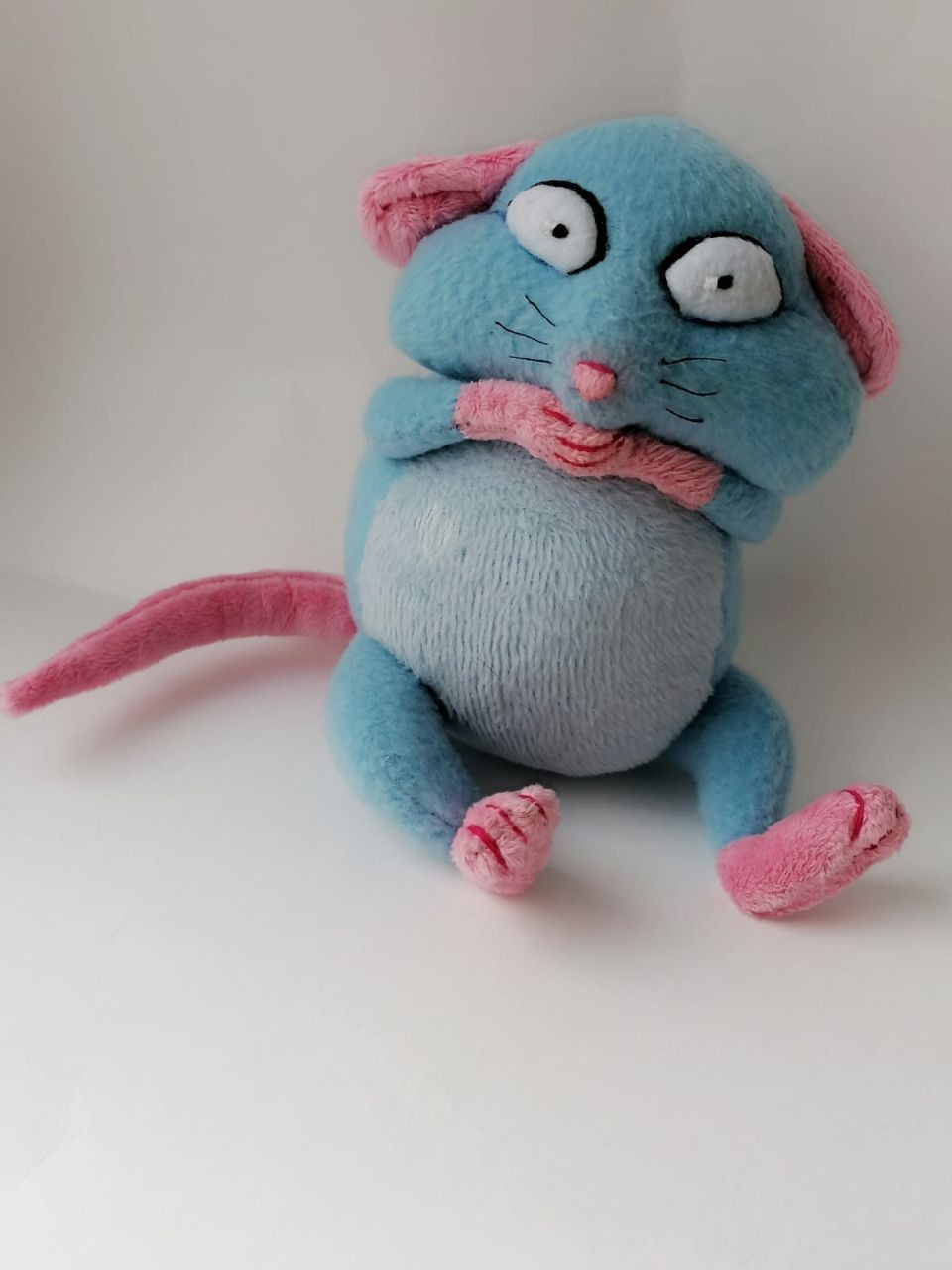 Blue rat plush with a pink tail Sky-blue rat plush with pink ears and a long pink tail, sewn to order from a messenger sticker
