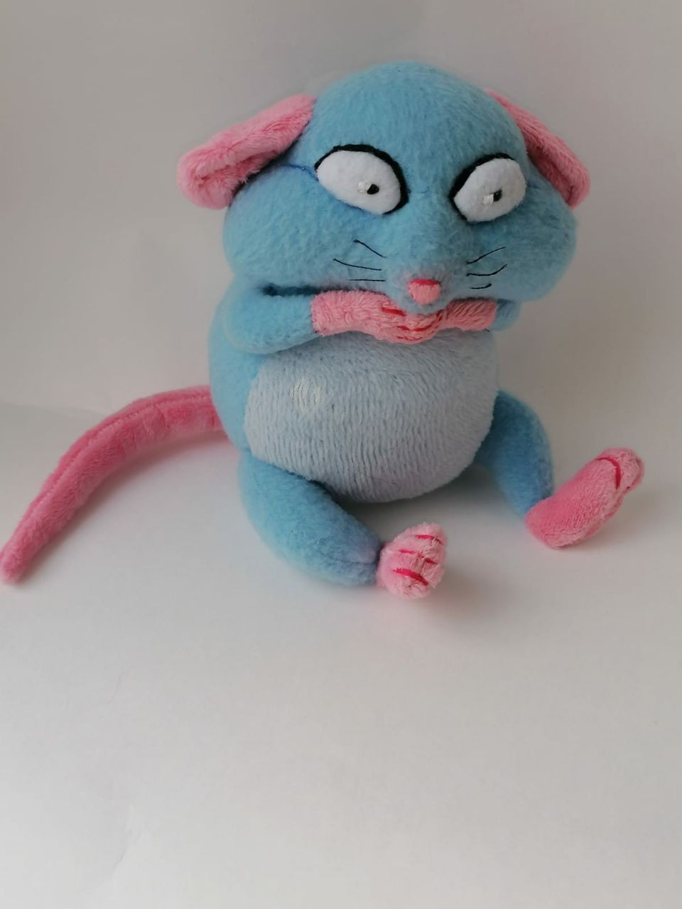 Blue rat plush with worried eyes Blue rat plush with big worried eyes and pink paws pressed to its mouth, sewn to order from a sticker