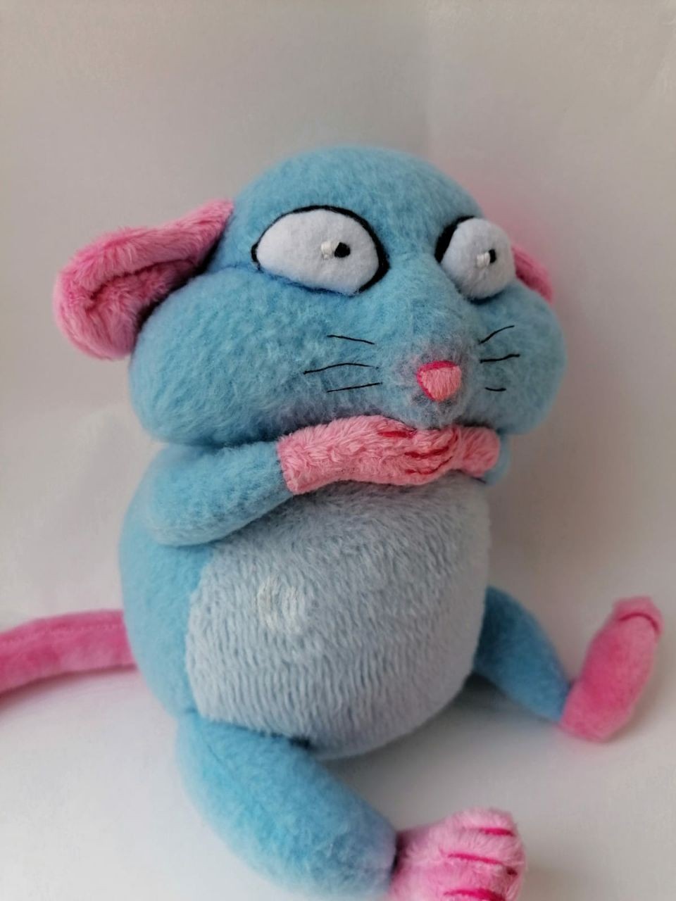 Blue rat sticker plush, startled face Startled face of a blue rat sticker plush: black-outlined eyes, stitched whiskers, pink nose, made to order