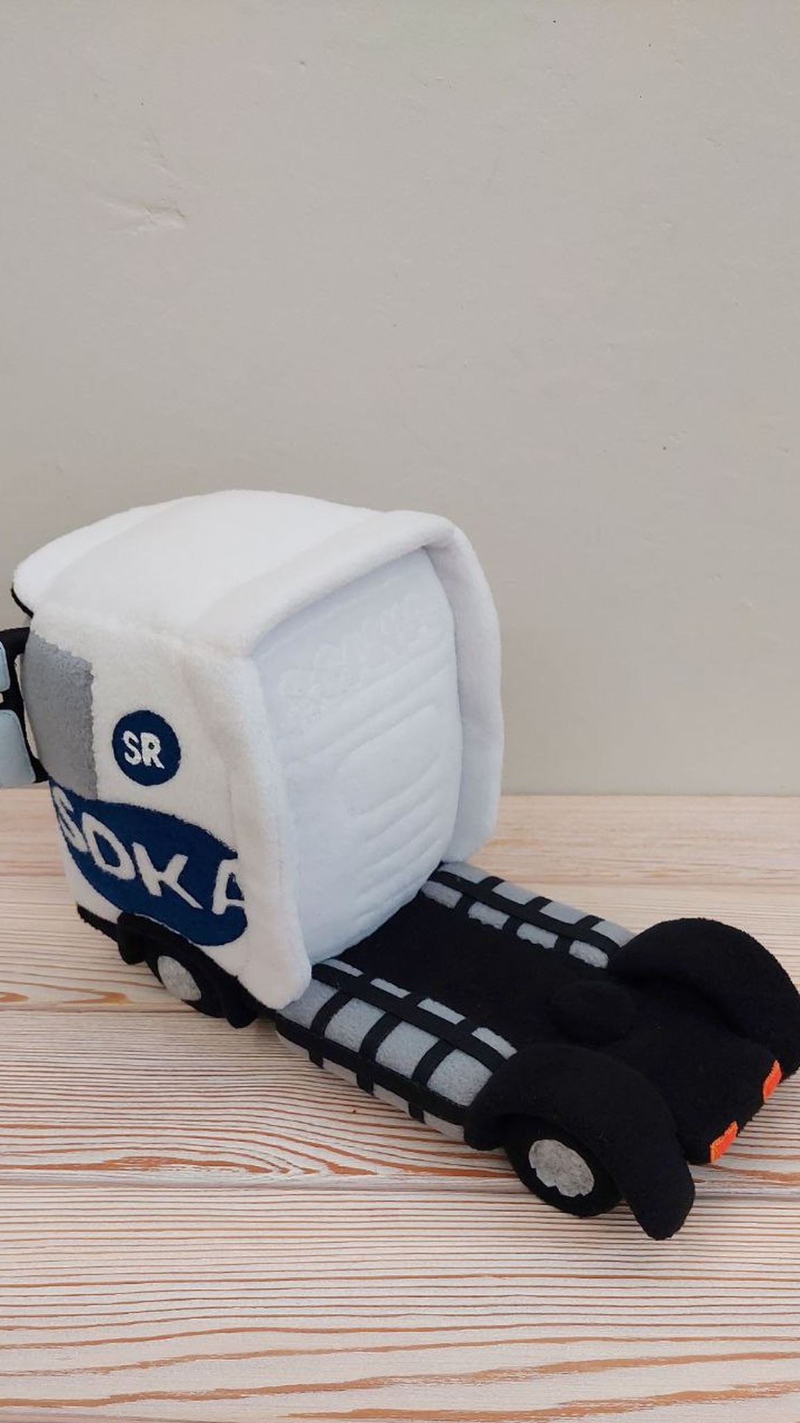 Branded plush truck cab with logo, black chassis and orange lights, handmade to order