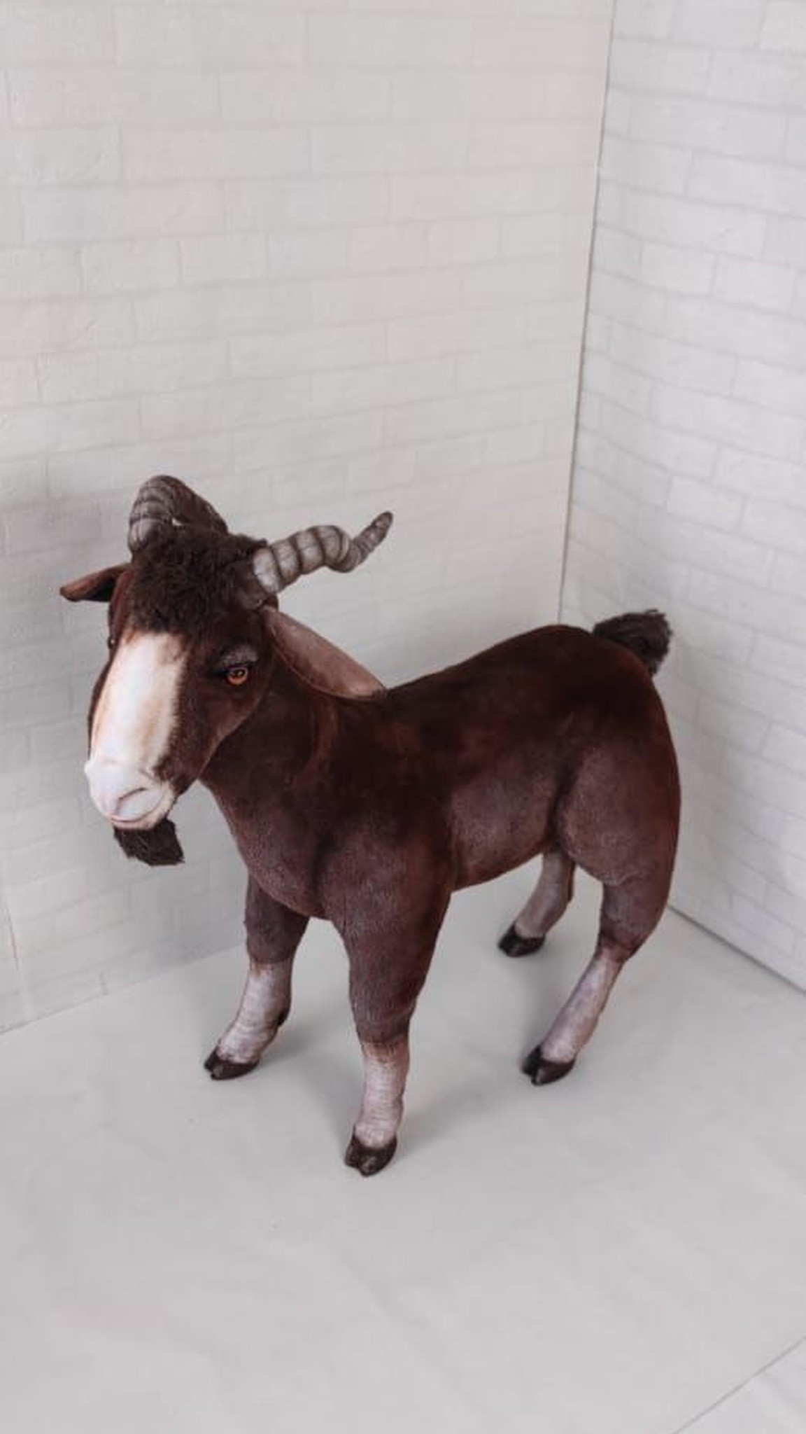 Realistic brown goat plush in reddish faux fur with pale legs and dark hooves, made to order