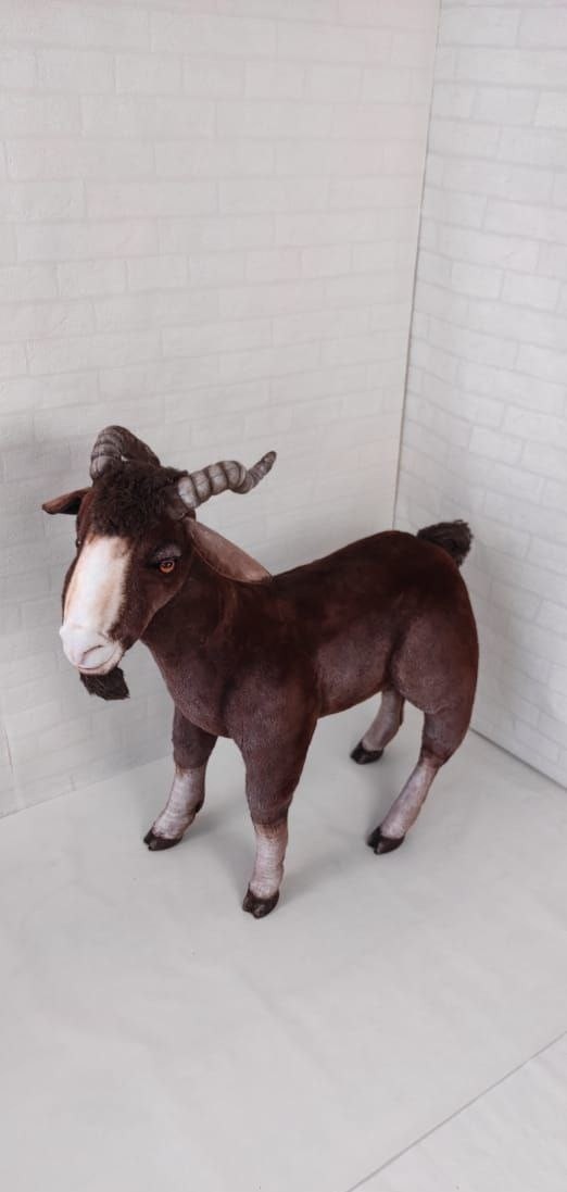 Realistic brown goat plush Realistic brown goat plush in reddish faux fur with pale legs and dark hooves, made to order