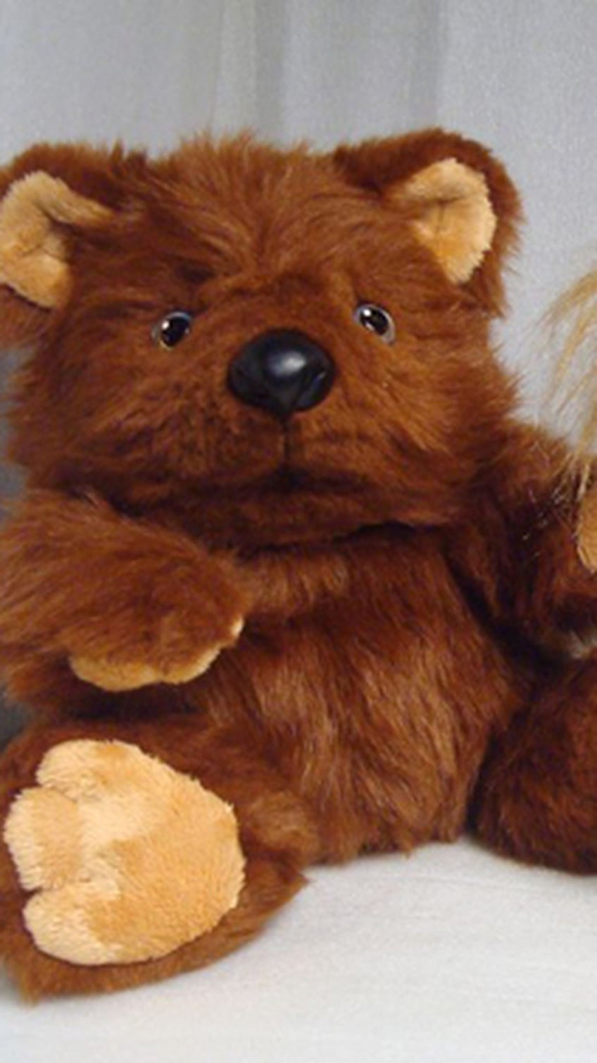 Brown bear plush with tan paw pads and a raised paw, handmade to order from the Skype hug emoticon