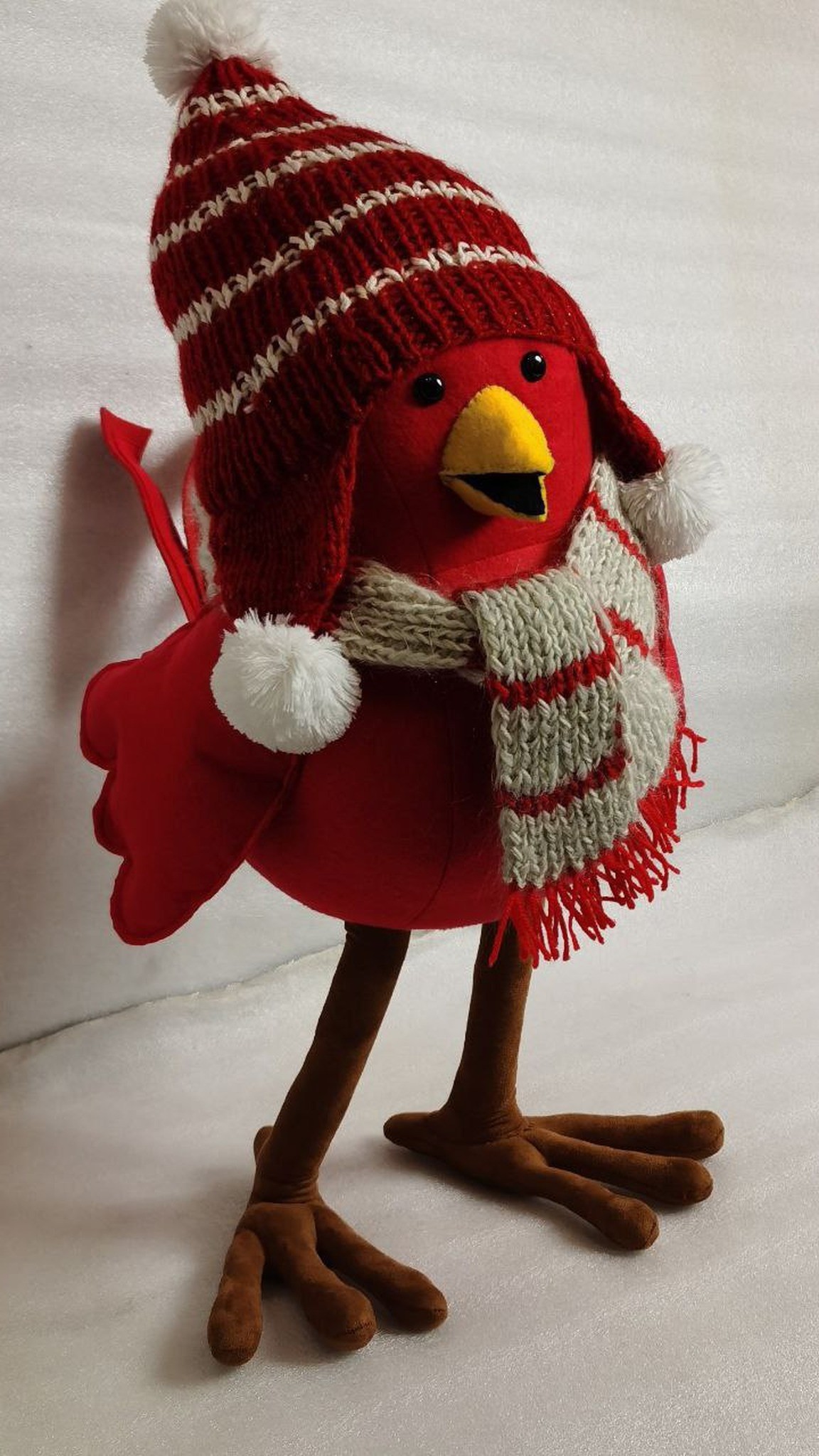 Bullfinch plush in a red striped hat and grey scarf on long brown legs, custom Christmas bird toy