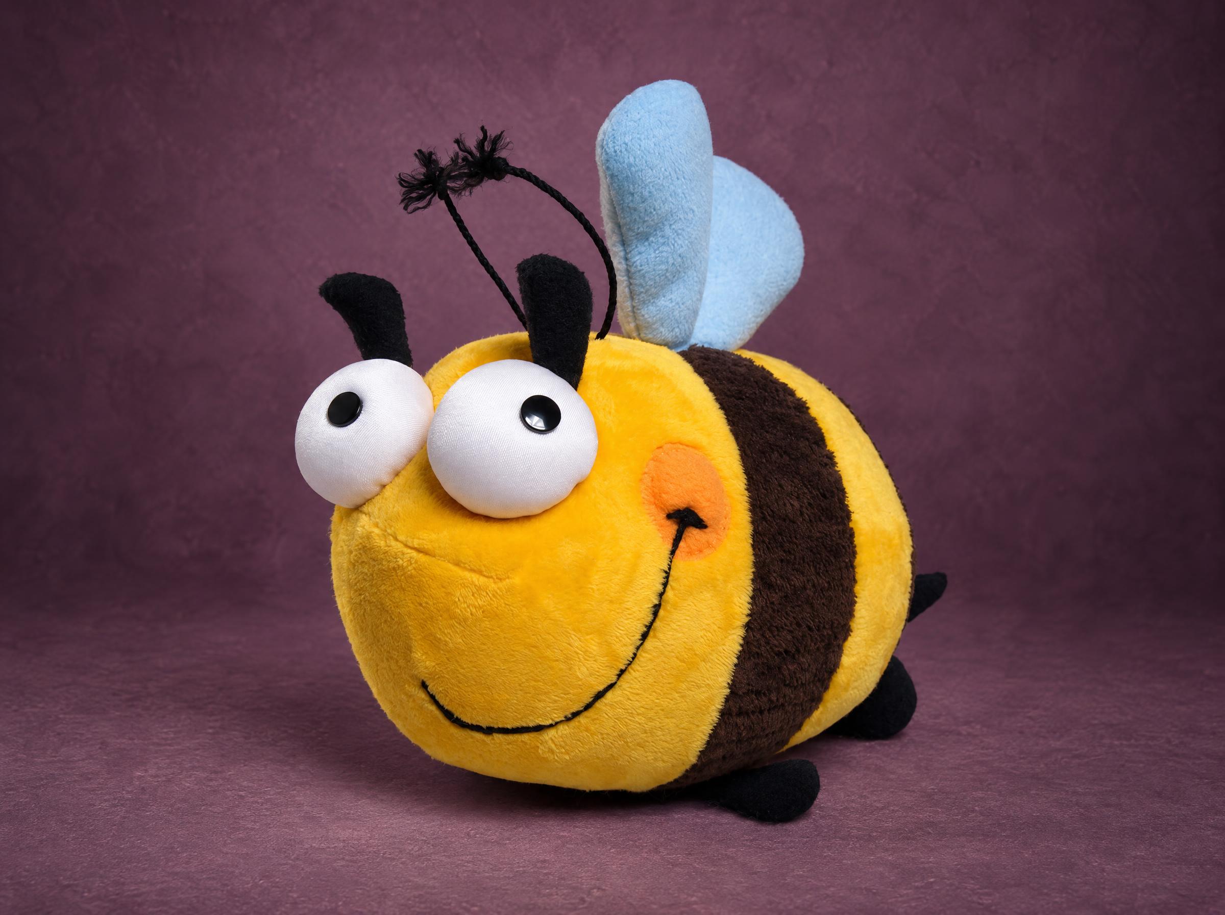 Bumblebee plush with big googly eyes, orange cheek and pale blue wings, handmade to order from a drawing