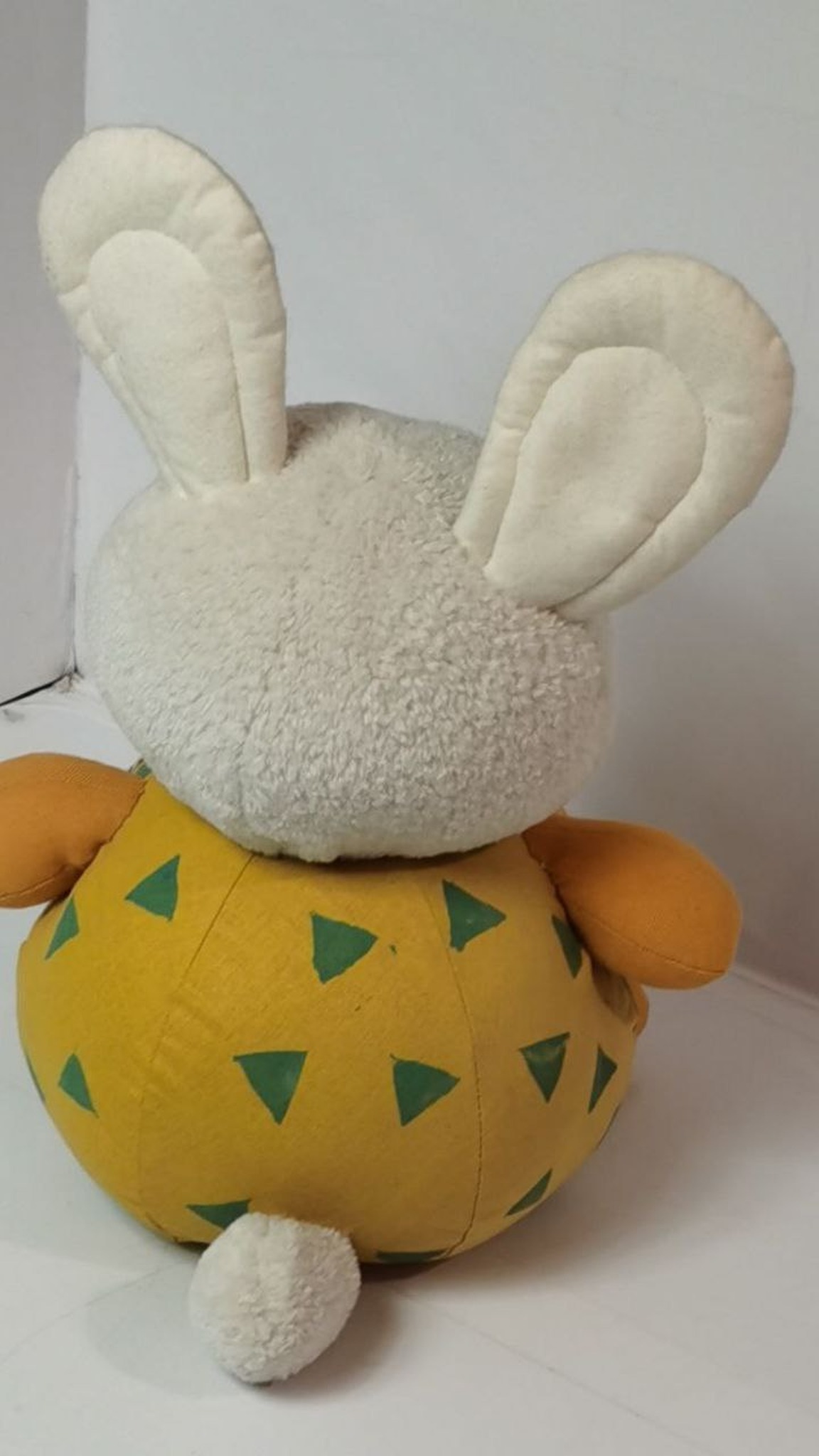 Bunny plush with a round yellow body, cream ears and a fluffy white tail, sewn to order from an AI picture