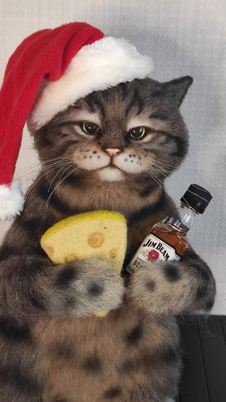 Cat meme plush in a Santa hat Custom cat meme plush in a Santa hat, made to order: sulky grey tabby holding cheese and a tiny whisky bottle