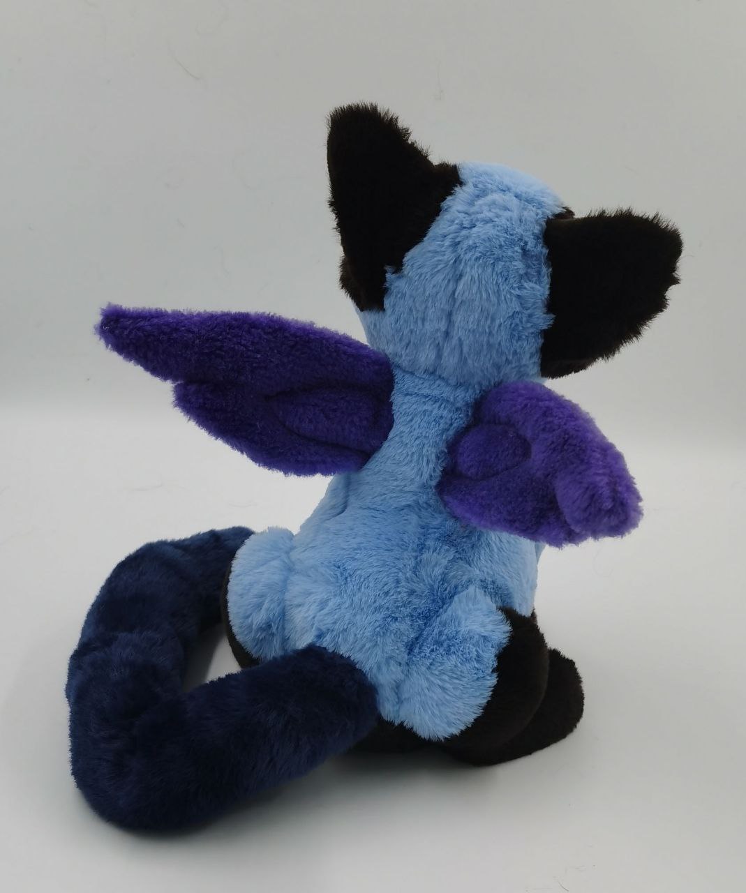 Cat with wings plush, movable wings Cat with wings plush, purple wings that move set on a blue faux fur back, custom winged cat sewn to order