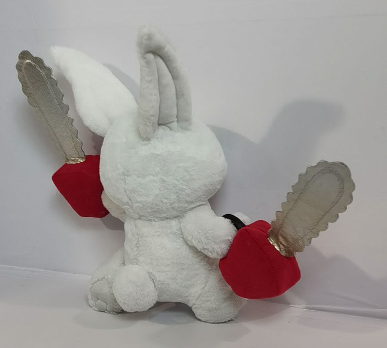 Chainsaw bunny plush with round tail Chainsaw bunny plush with a round white tail, long ears and red chainsaw blocks, handmade to order