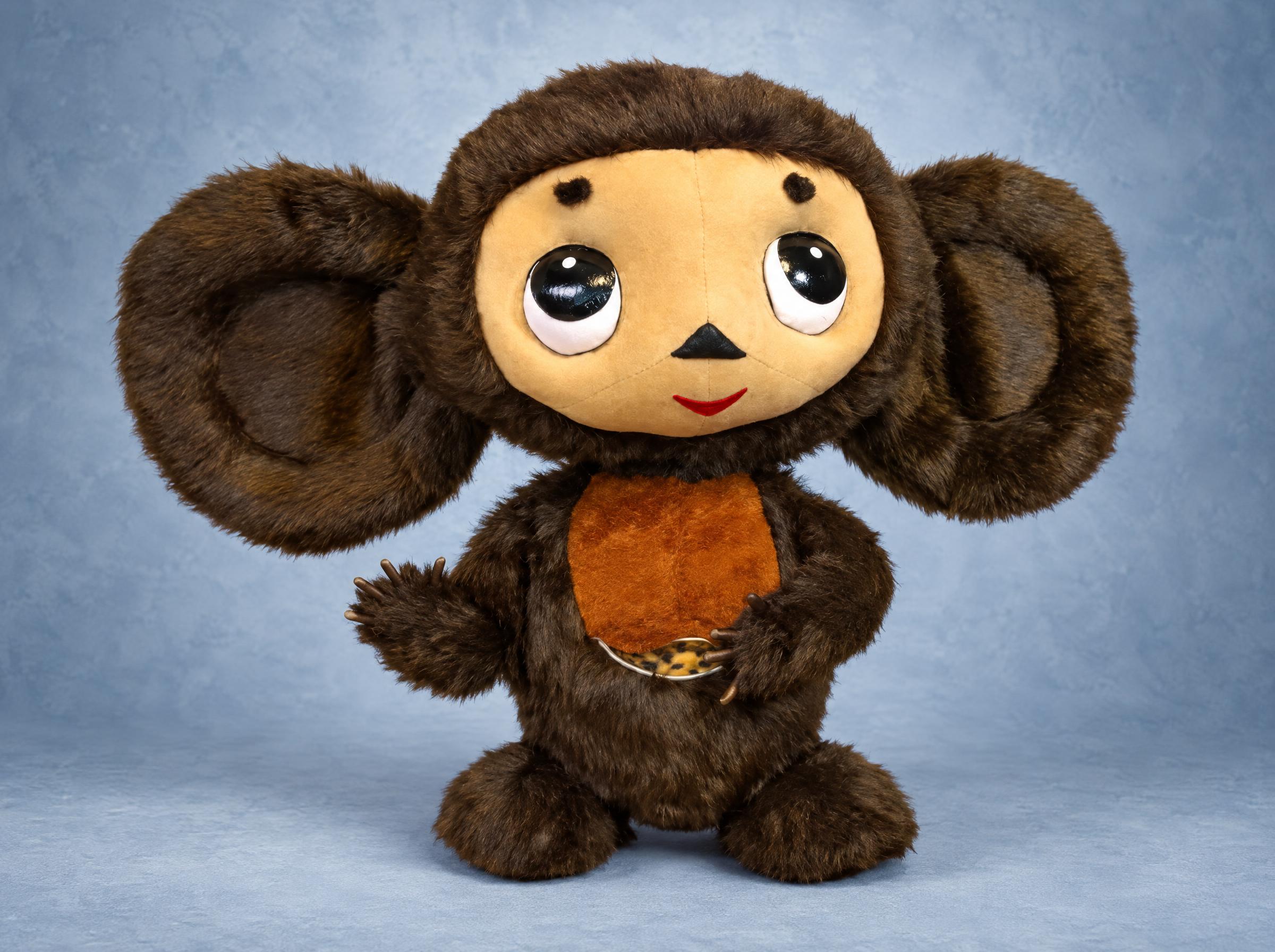 Big Cheburashka plush in dark brown faux fur with huge round ears and glossy black eyes, handmade to order