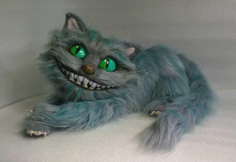 Realistic Cheshire Cat plush with green eyes Realistic Cheshire Cat plush with green slit eyes, wide grin and striped tail, handmade faux fur cat to order