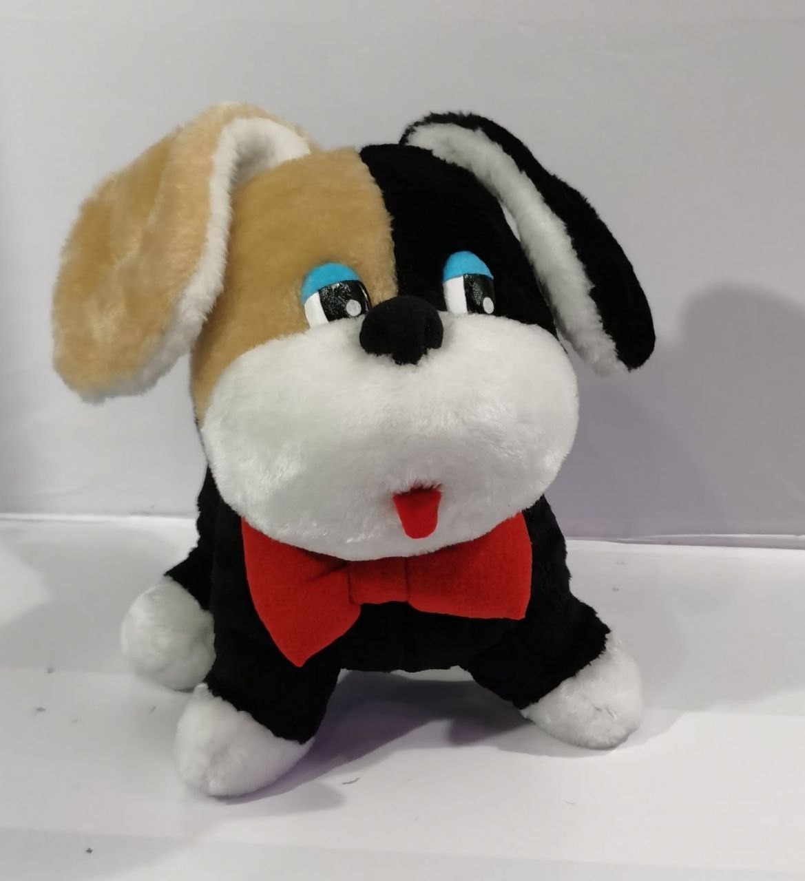 Childhood stuffed dog with a red bow tie Childhood stuffed dog replica with blue eyes, red tongue and red bow tie, custom made from a family photo