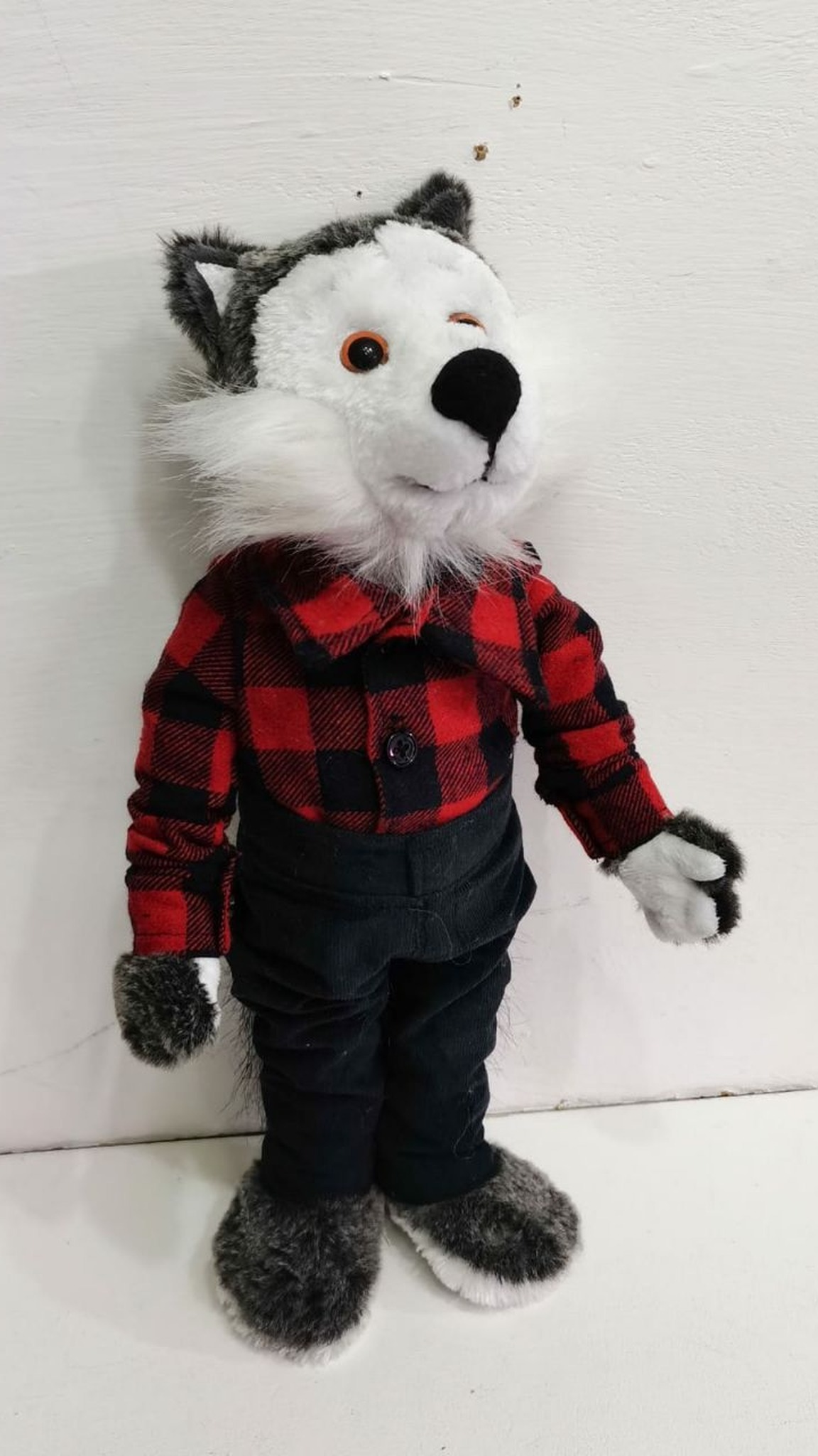 Childhood wolf plush replica standing in a red buffalo check shirt and dark trousers, handmade to order