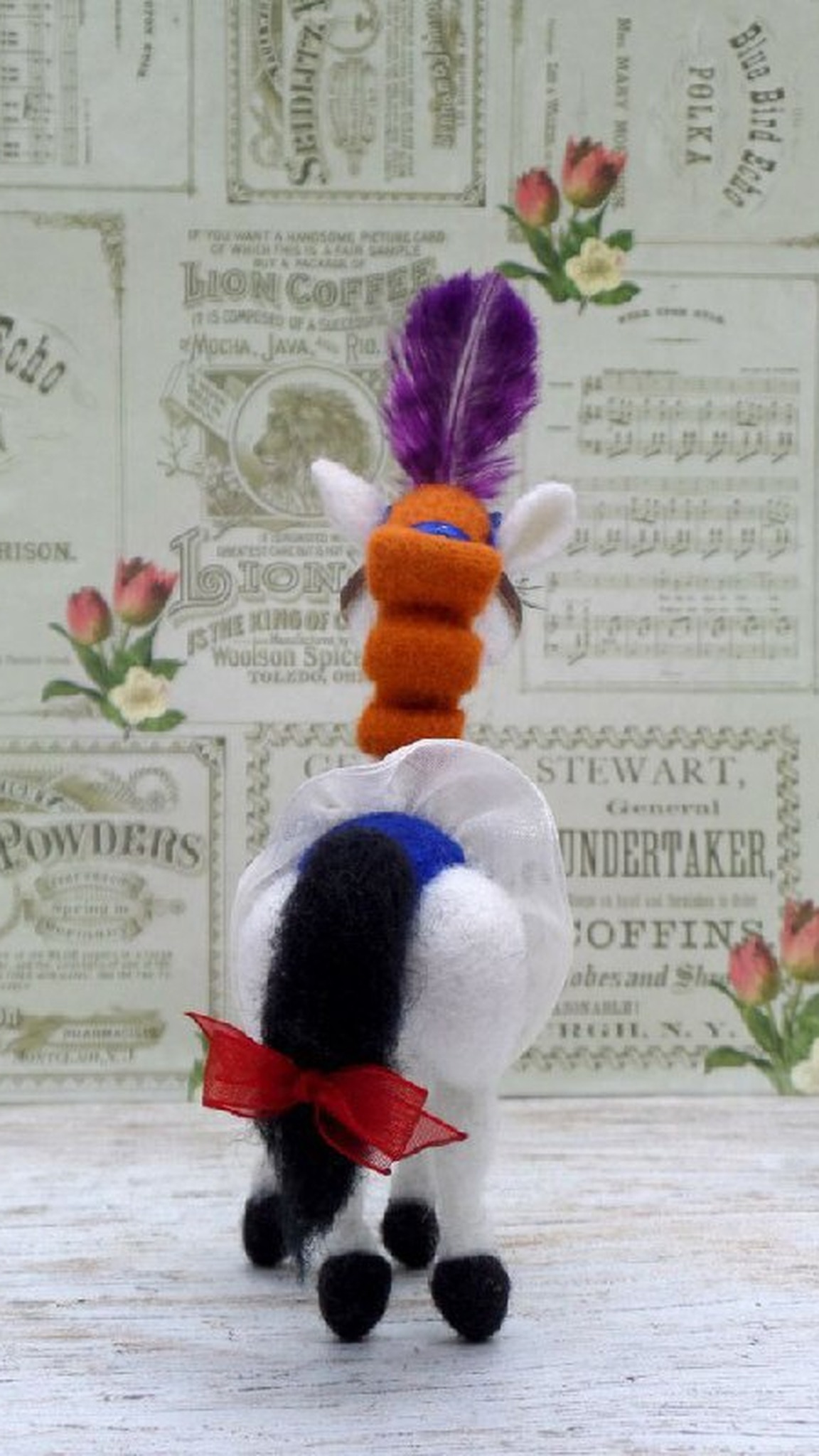 Handmade circus horse plush Angela made to order, orange curls down the neck, a red bow on the black tail