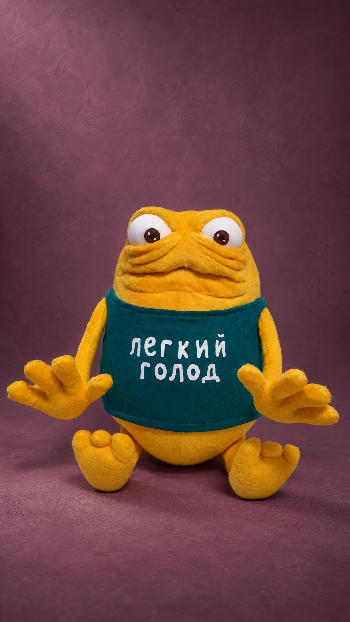 Custom commercial mascot plush: yellow TV ad monster with sculpted wrinkles and a green tank top, made to order