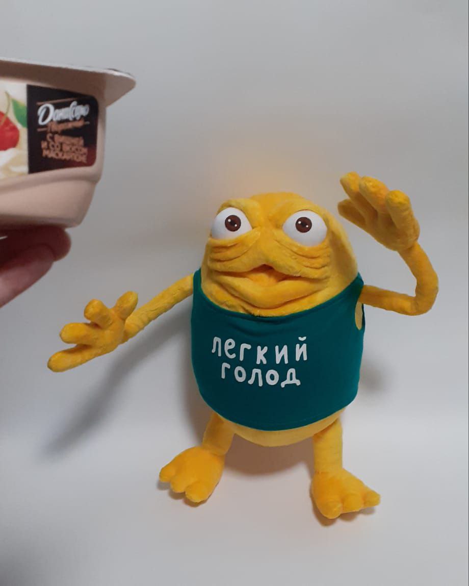 Commercial mascot plush, waving Custom yellow monster plush from a yogurt commercial waving, long thin arms and a green tank top, made to order