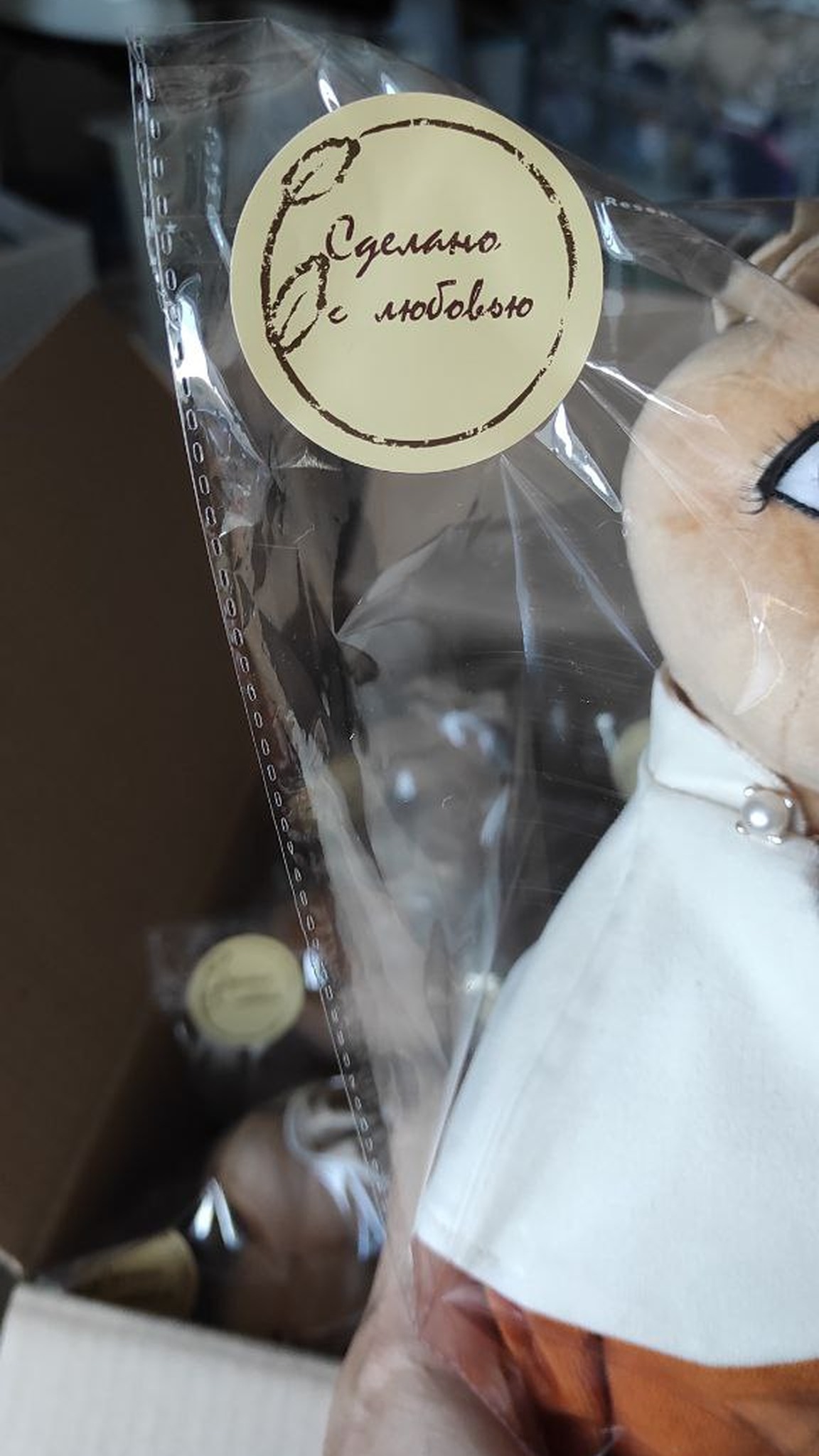 Year of the Snake plush in its own clear bag, a custom corporate New Year gift