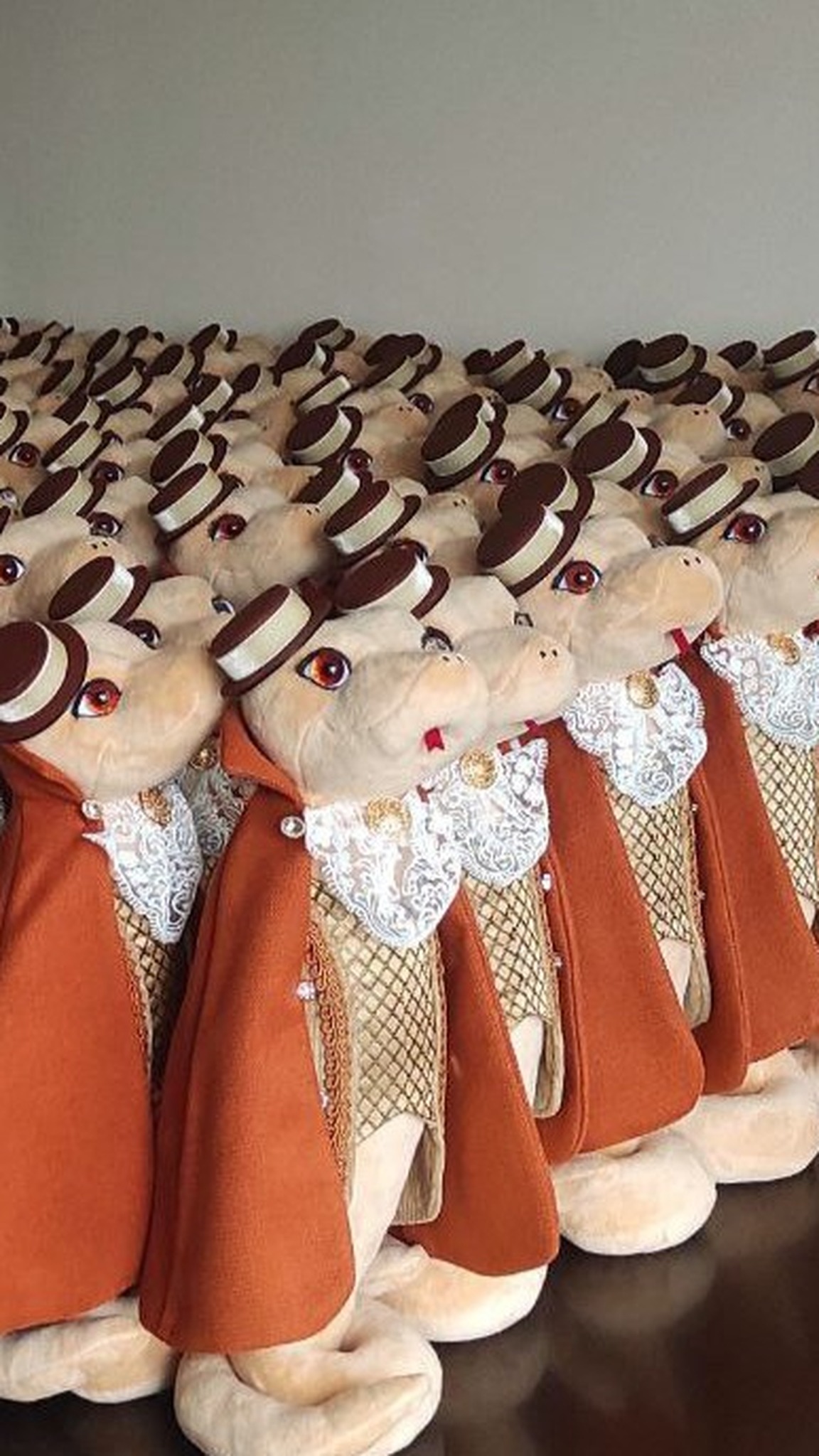 Snake plush gentlemen in capes and top hats, a handmade corporate New Year gift batch