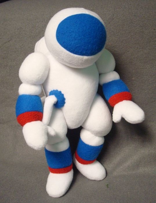 Cosmonaut plush in white fleece Cosmonaut plush in white fleece with a round helmet, blue visor and chest hose, handmade to order