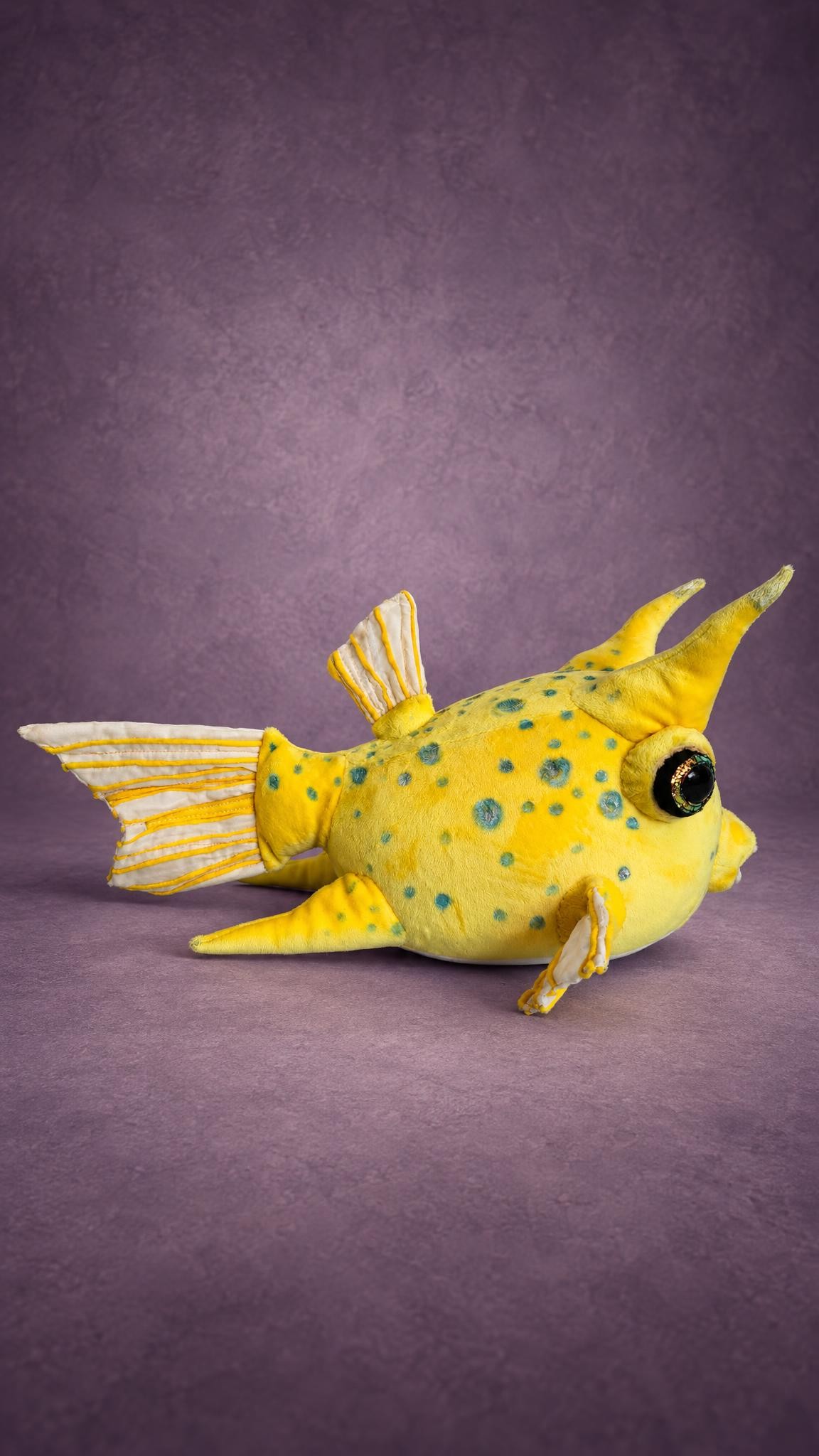 Yellow cowfish plush with horns, striped white fins and teal spots, handmade to order
