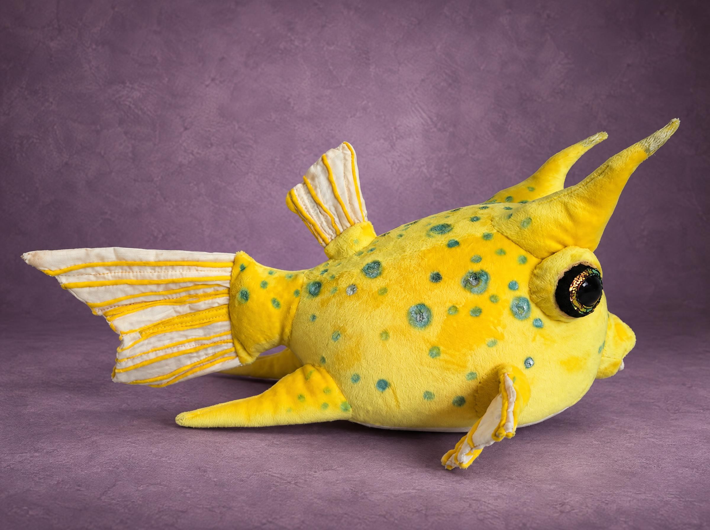 Longhorn cowfish plush in yellow with teal spots, two horns and a glittery eye, sewn by hand to order