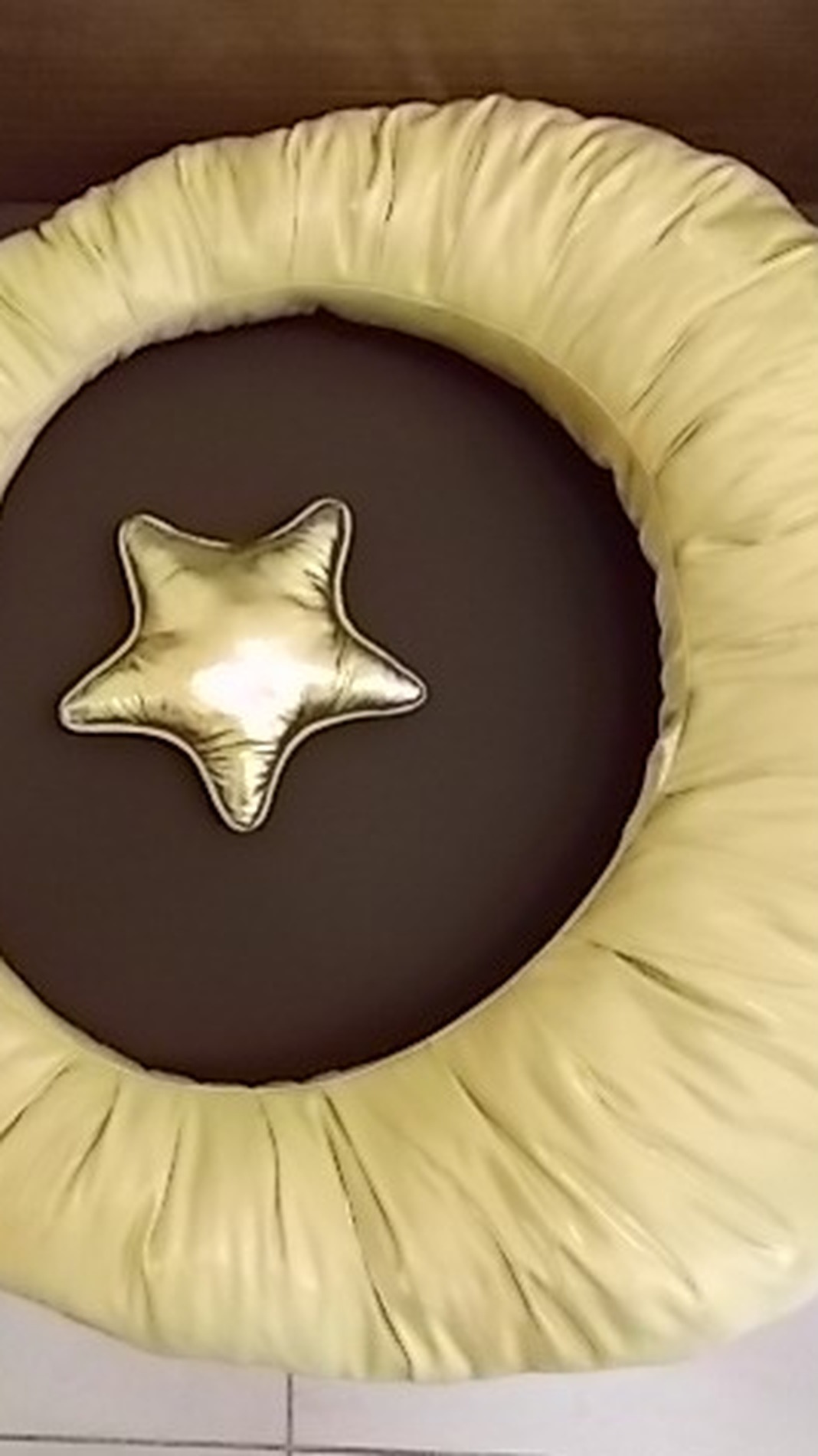 Crescent moon pillow in gathered pale-gold fabric with a gold star cushion, custom photo props