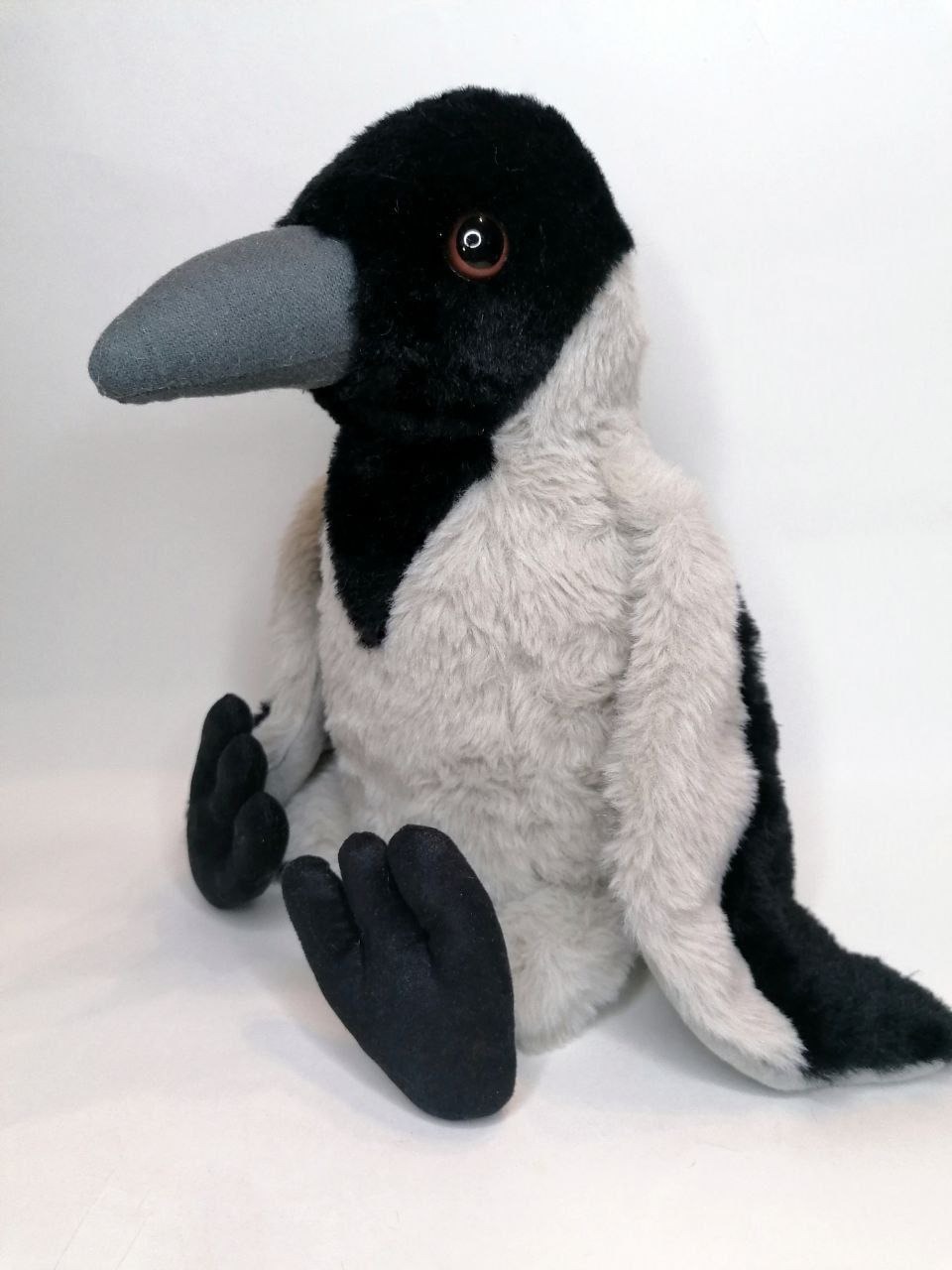 Crow stuffed animal with a black hood Crow stuffed animal with a black hood, brown eyes and velvety three-toed feet, sewn by hand to order