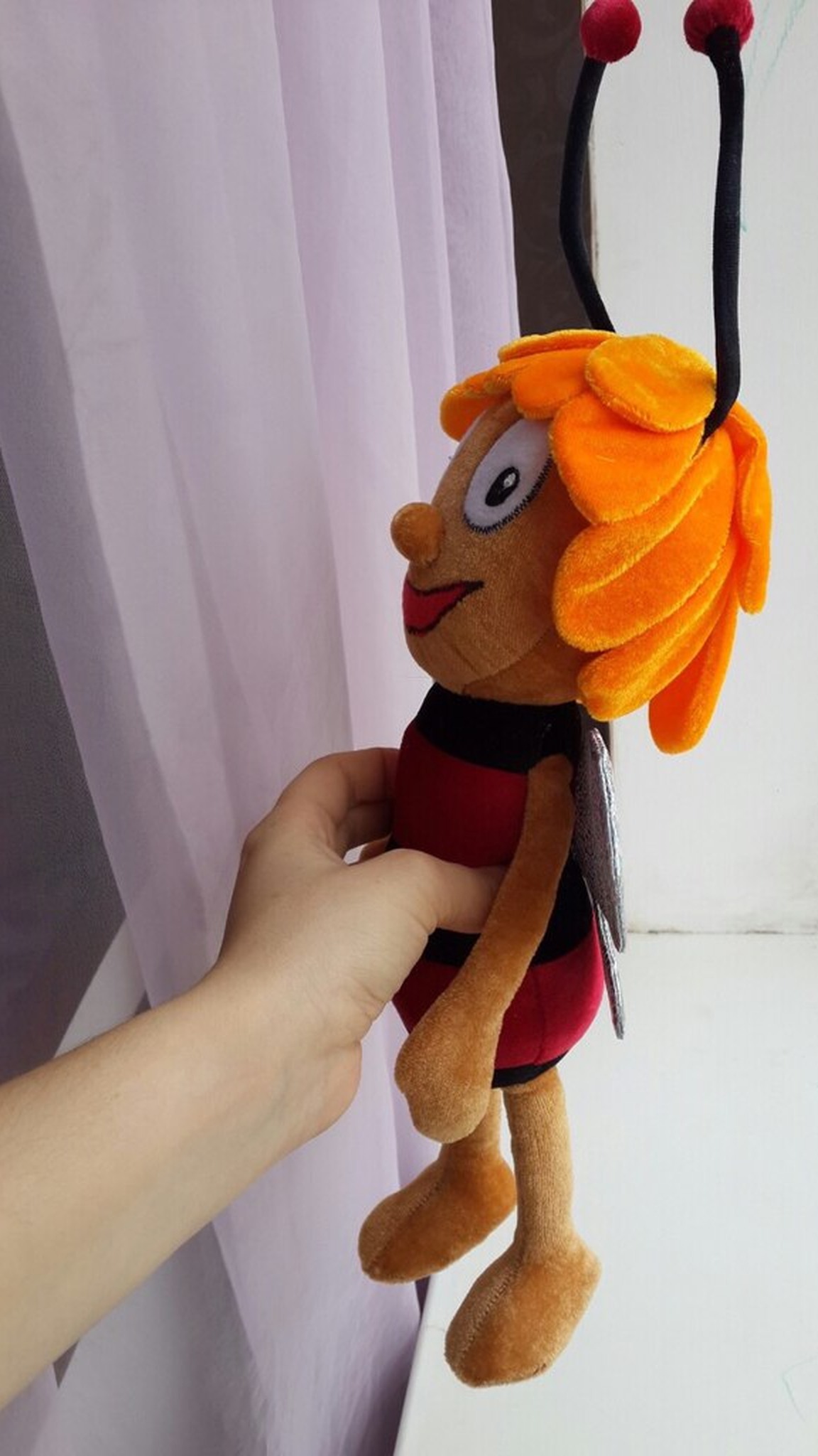 Custom bee stuffed animal with layered orange petal hair, red-pompom antennae and a round nose, made to order