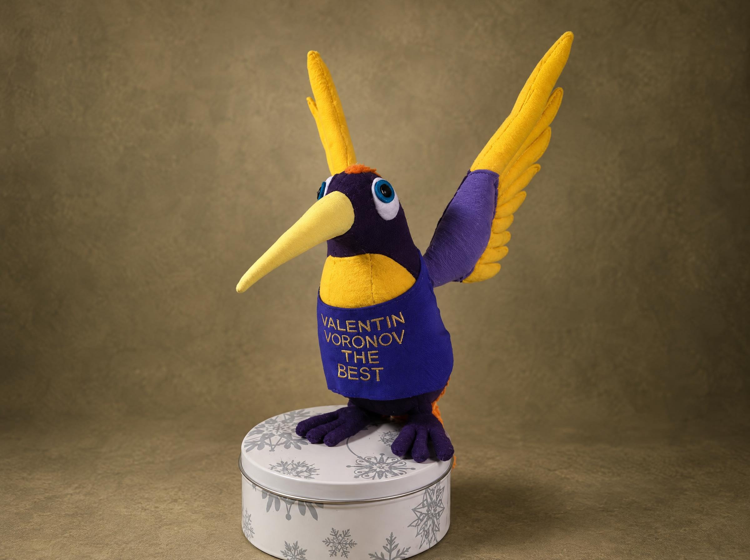Custom bird plush in purple and yellow with Valentin Voronov embroidered on its vest, handmade to order