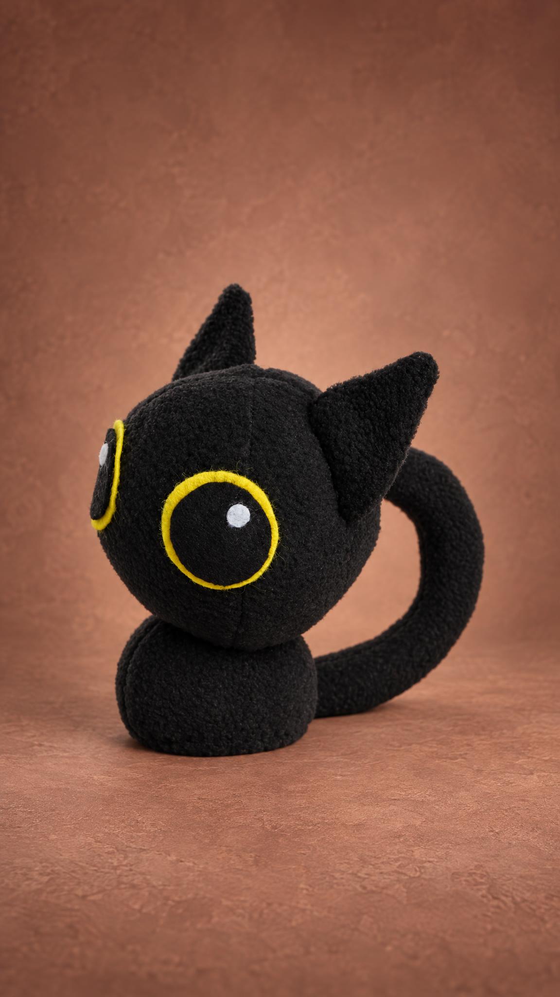 Custom black kitten plush from a drawing, round head, pointed ears and a curved tail, handmade to order