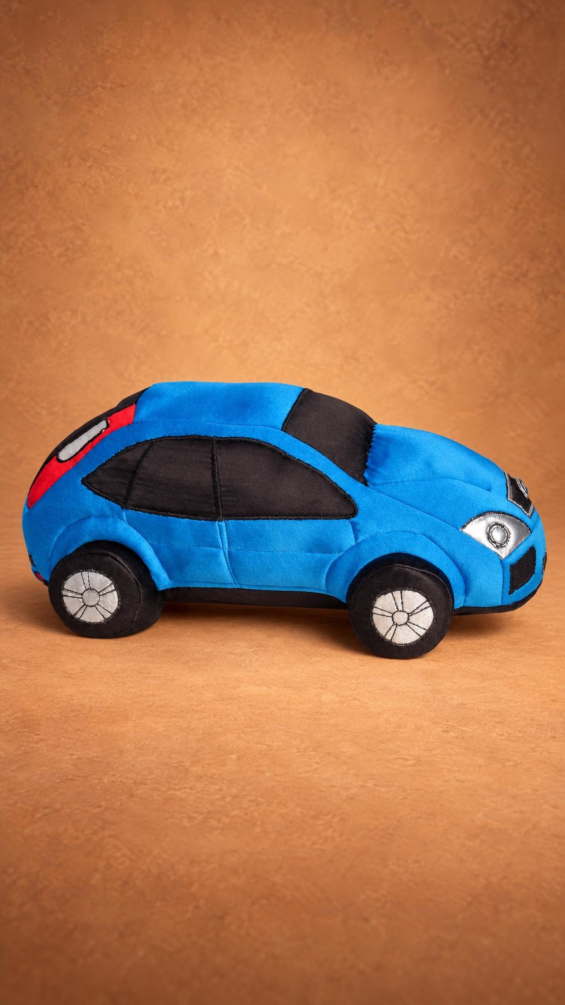 Blue car plush with embroidered silver rims and red rear panels, a custom soft toy car made to order