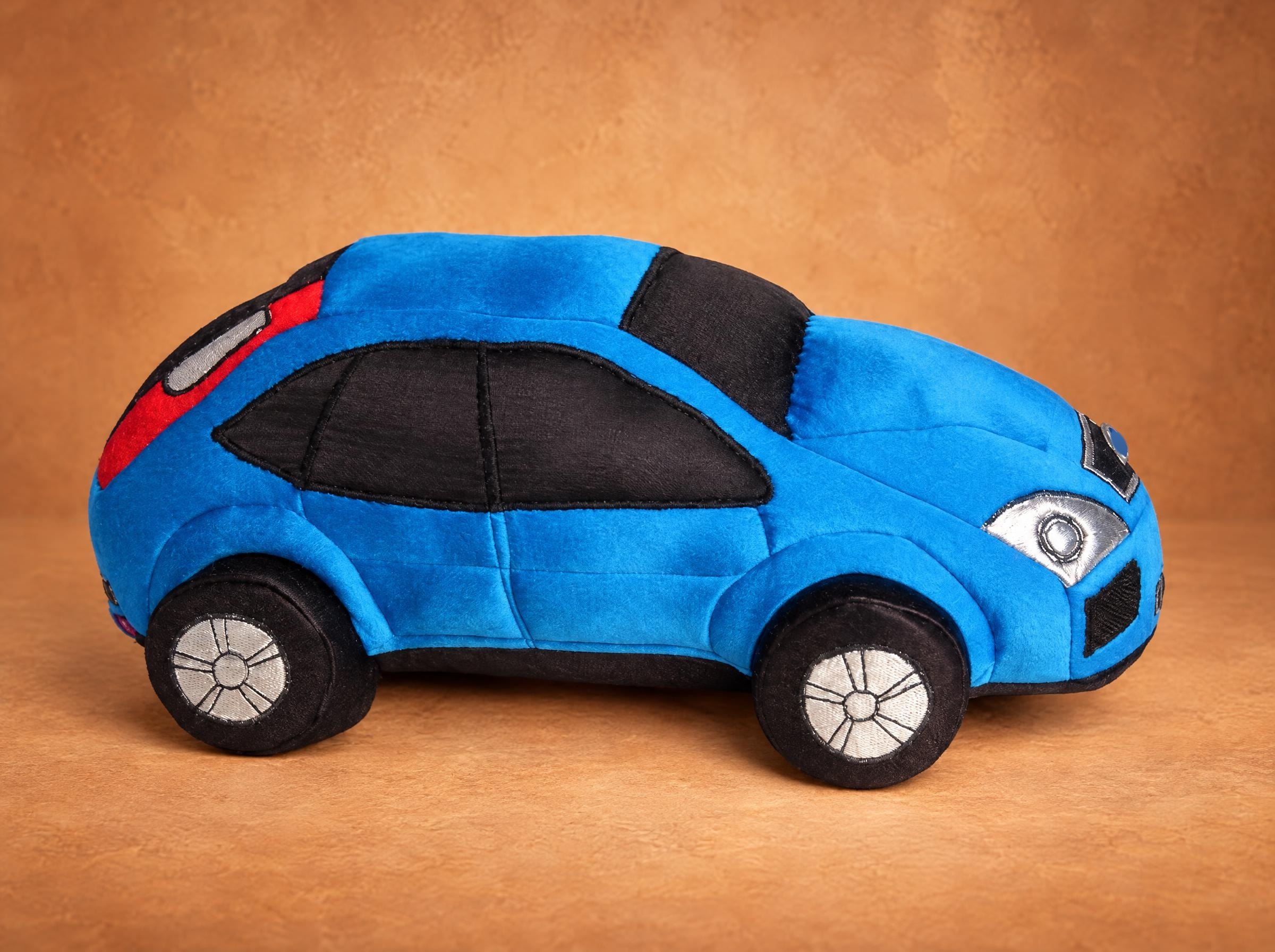 Custom car plush: blue hatchback with black stitched windows and silver headlights, sewn by hand to order