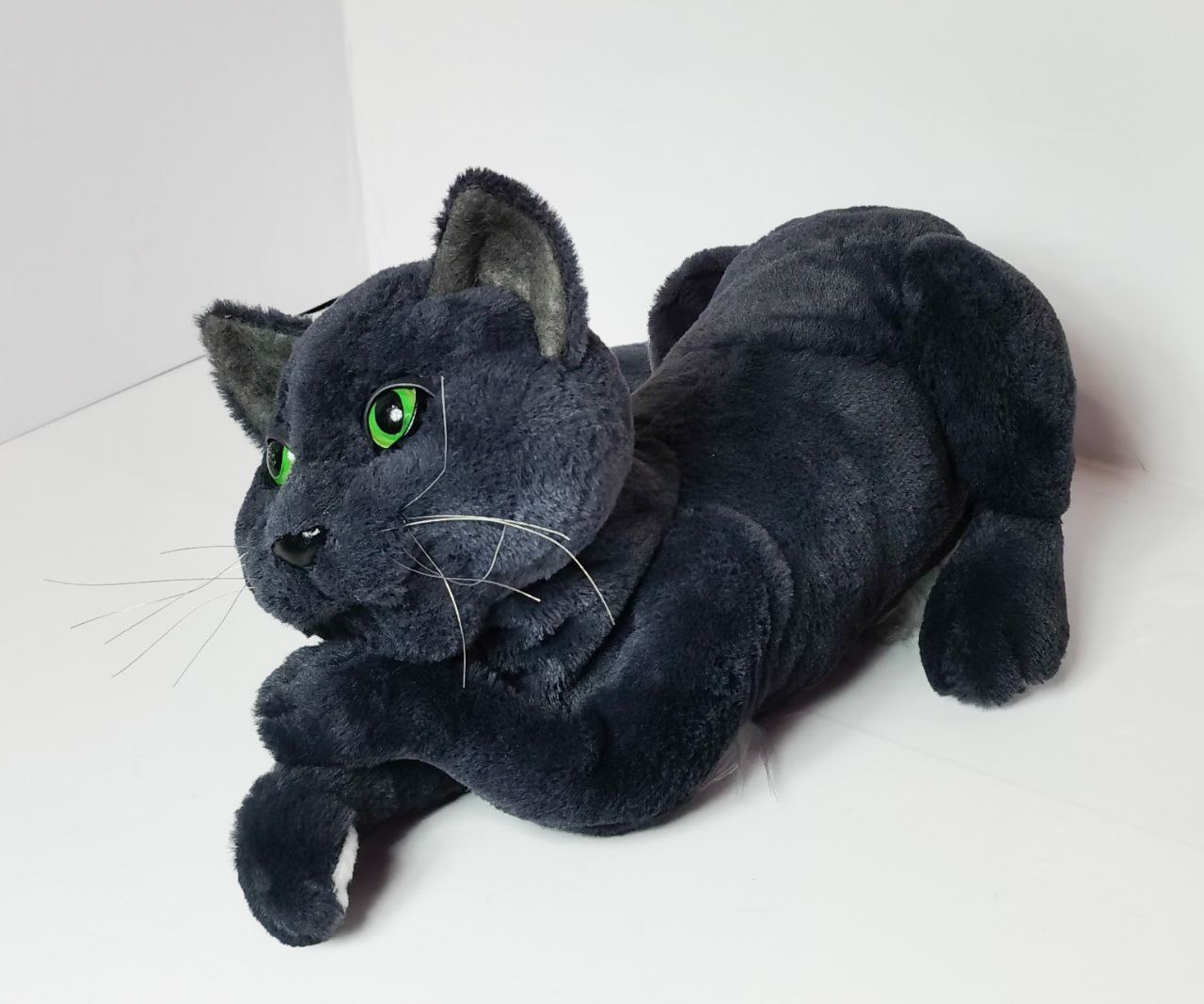 Custom cat plush from photo, grey cat Custom cat plush from photo, a blue-grey cat with green eyes resting its chin on its paws, made to order